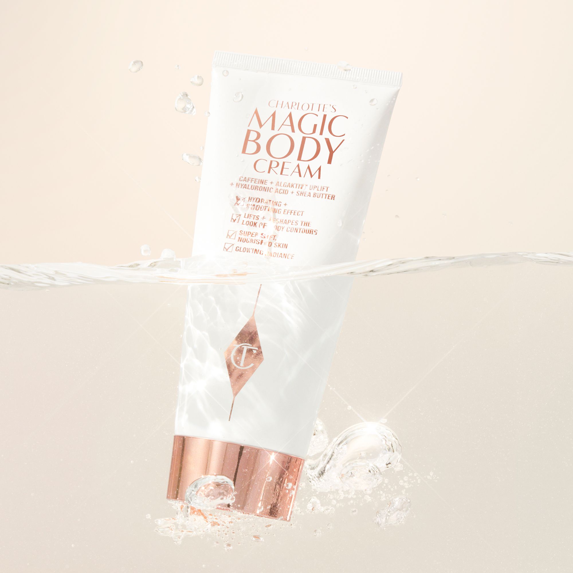 image of the charlotte tilbury magic body cream floating in water