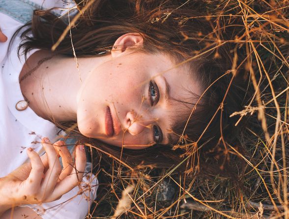 Autumn fragrance girl lying in a field