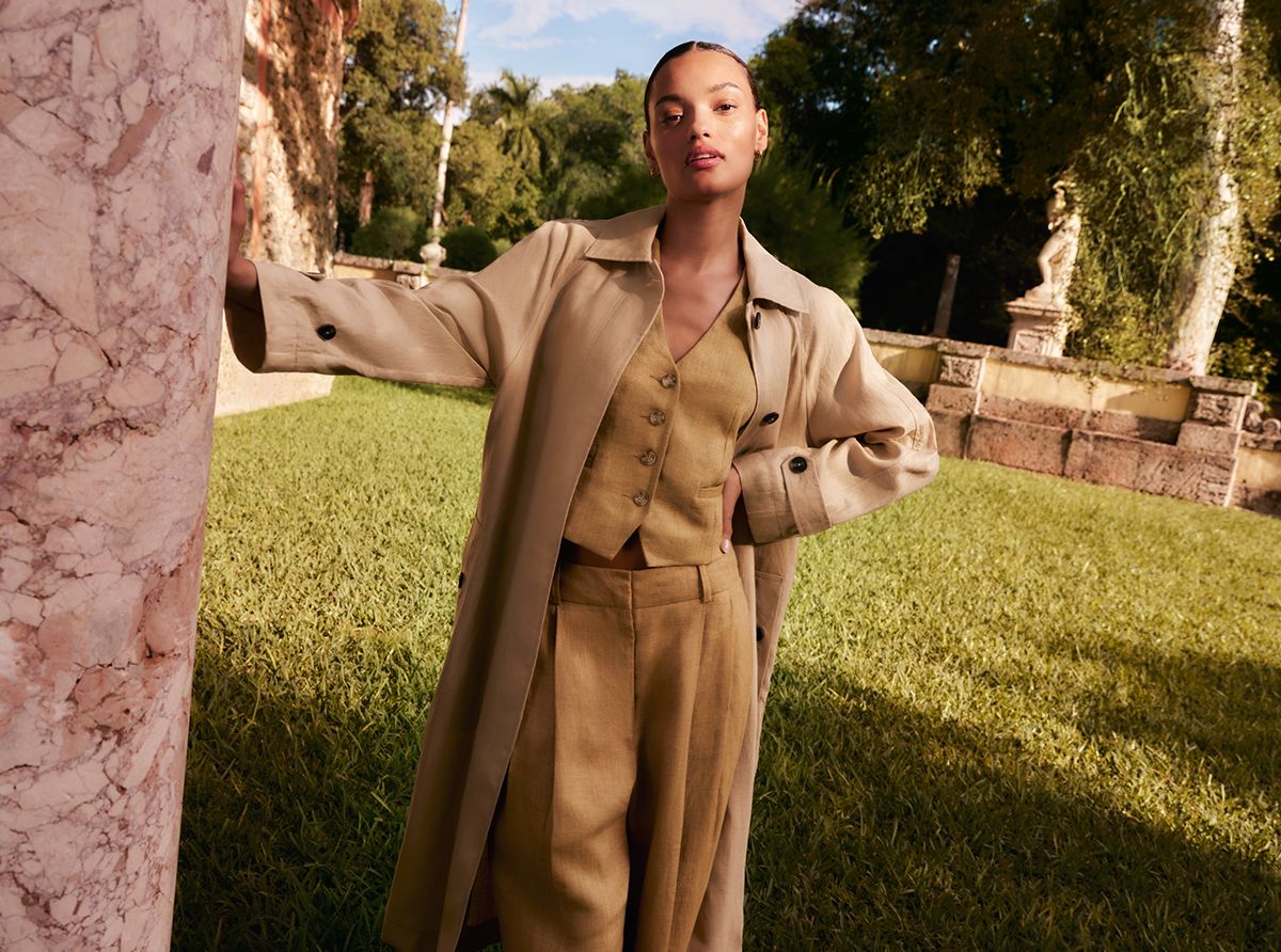 Image of a lady in a beige trench coat