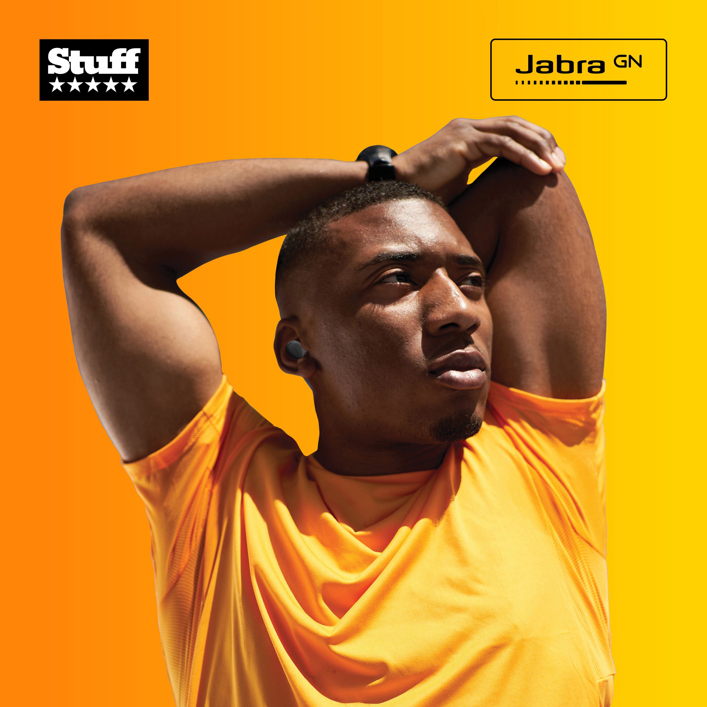 Man in yellow t-shirt with Jabra earbuds