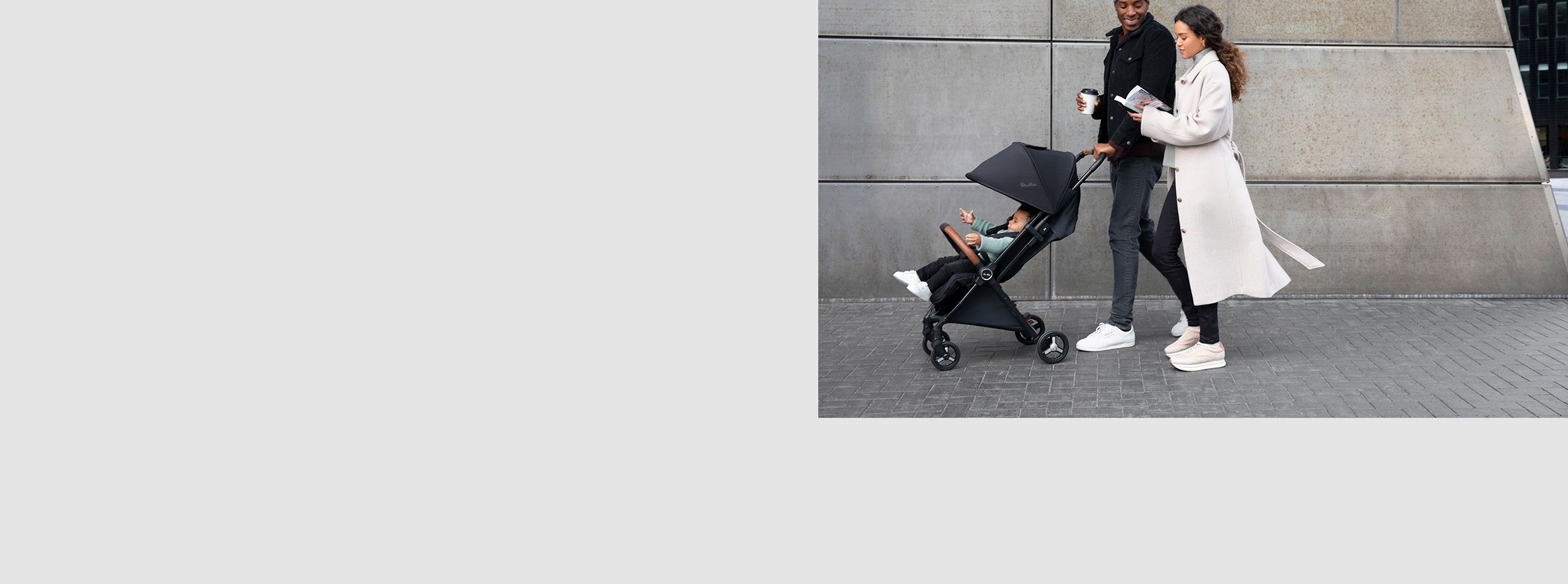 Image of a mum and dad pushing their Silver Cross Pushchair