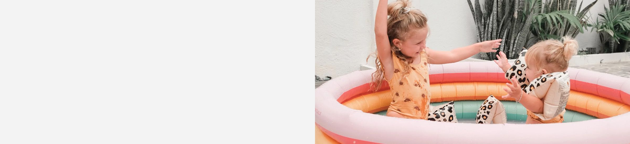 Two girls in an inflatable pool
