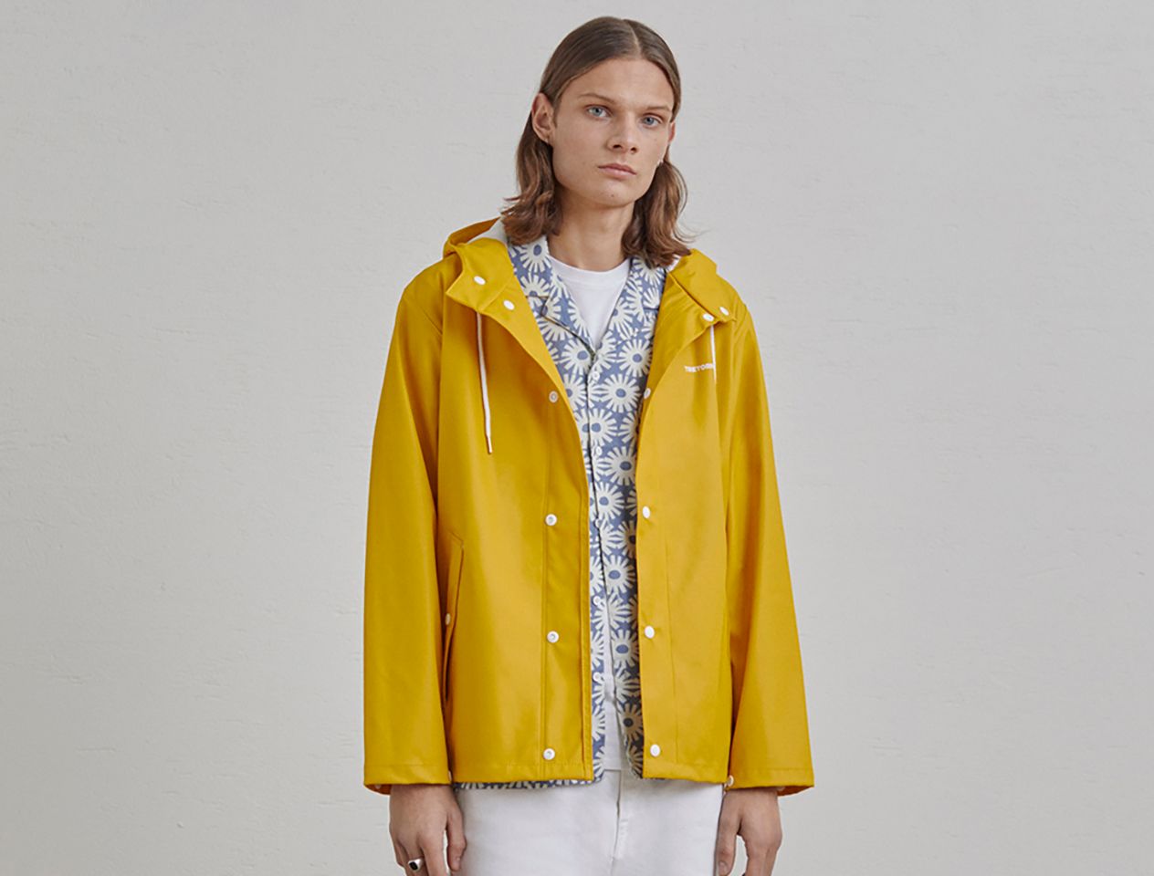 Model in Tretorn yellow jacket