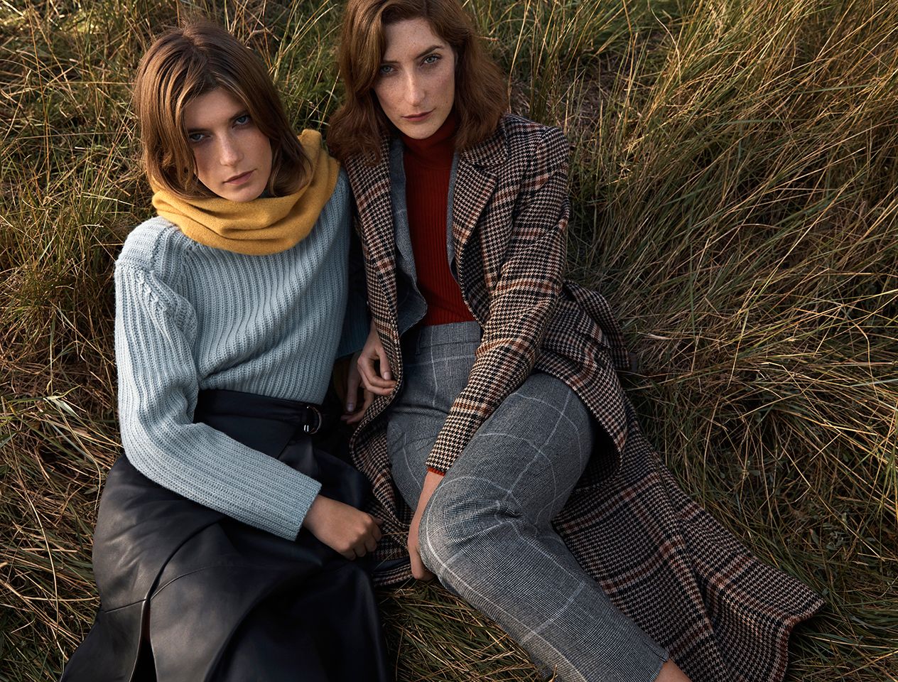 Women sitting outside in cashmere knitwear