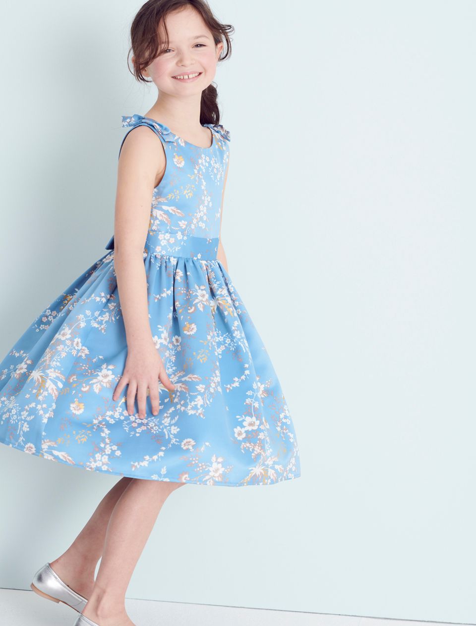 girl in blue floral dress