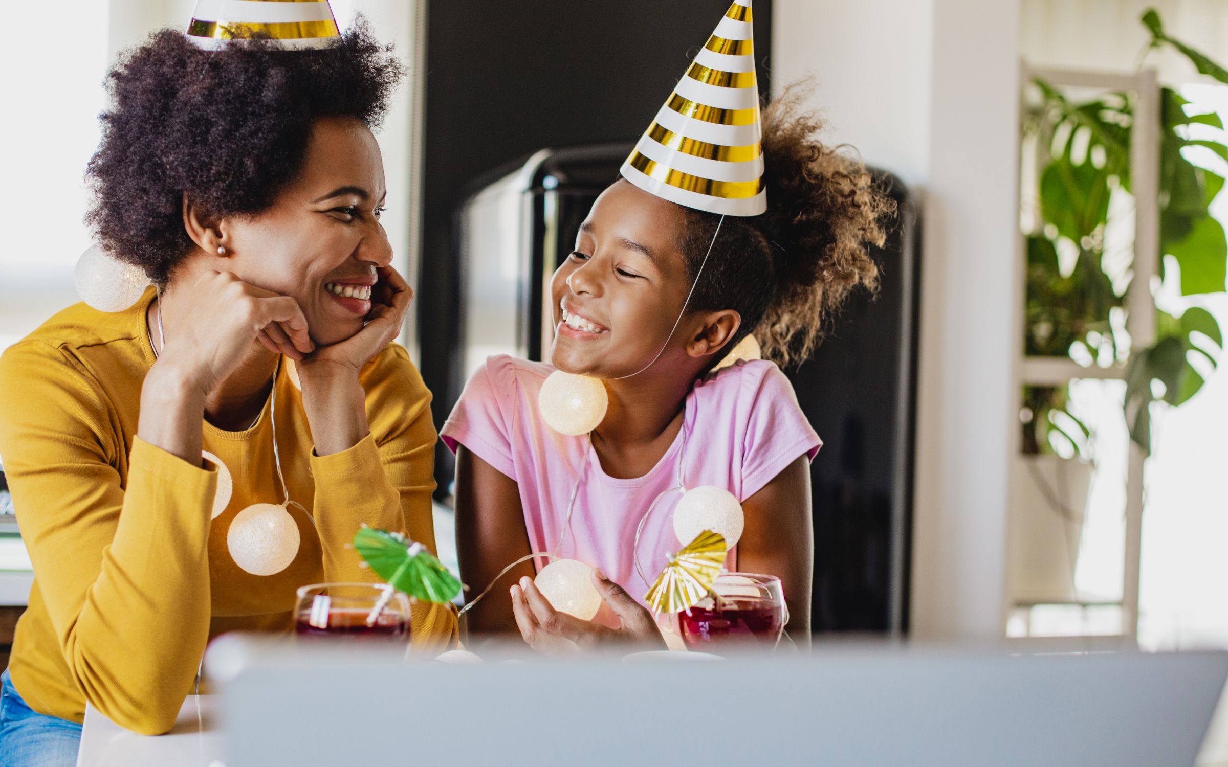Mother and daughter enjoying an online birthday party