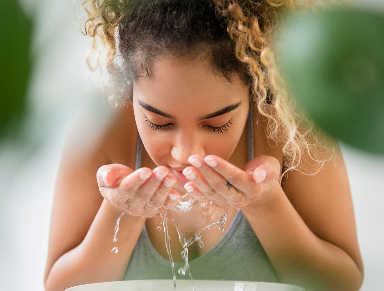 Woman washing face 