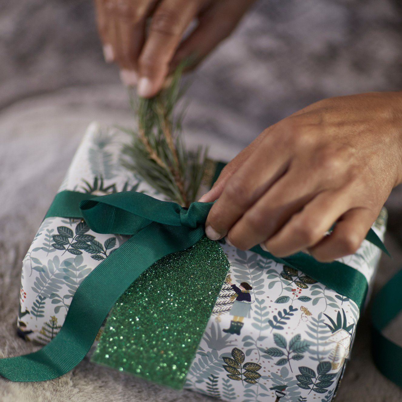 Person wrapping gift