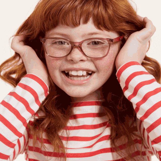 an moving image of a red haired girl wearing glasses