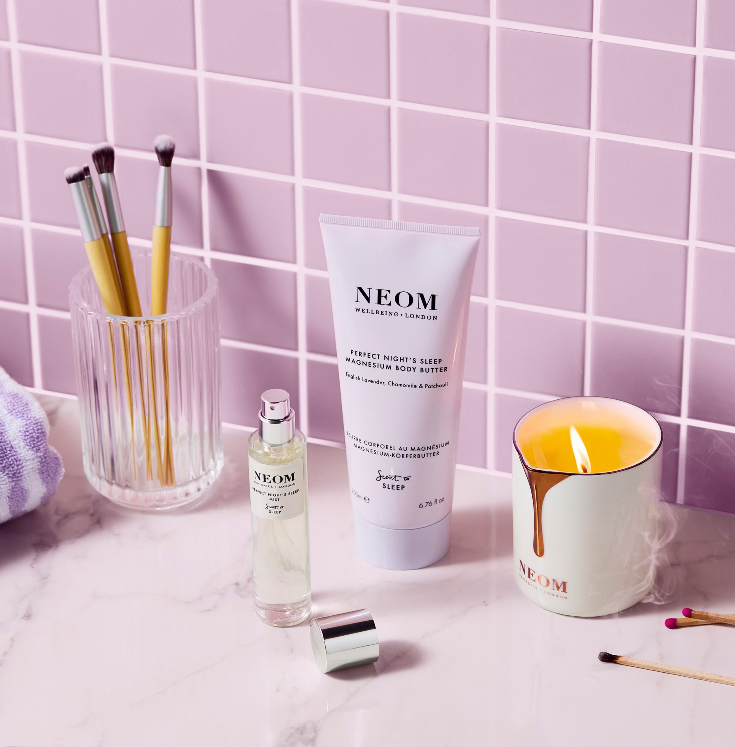 Neom products on a pink background