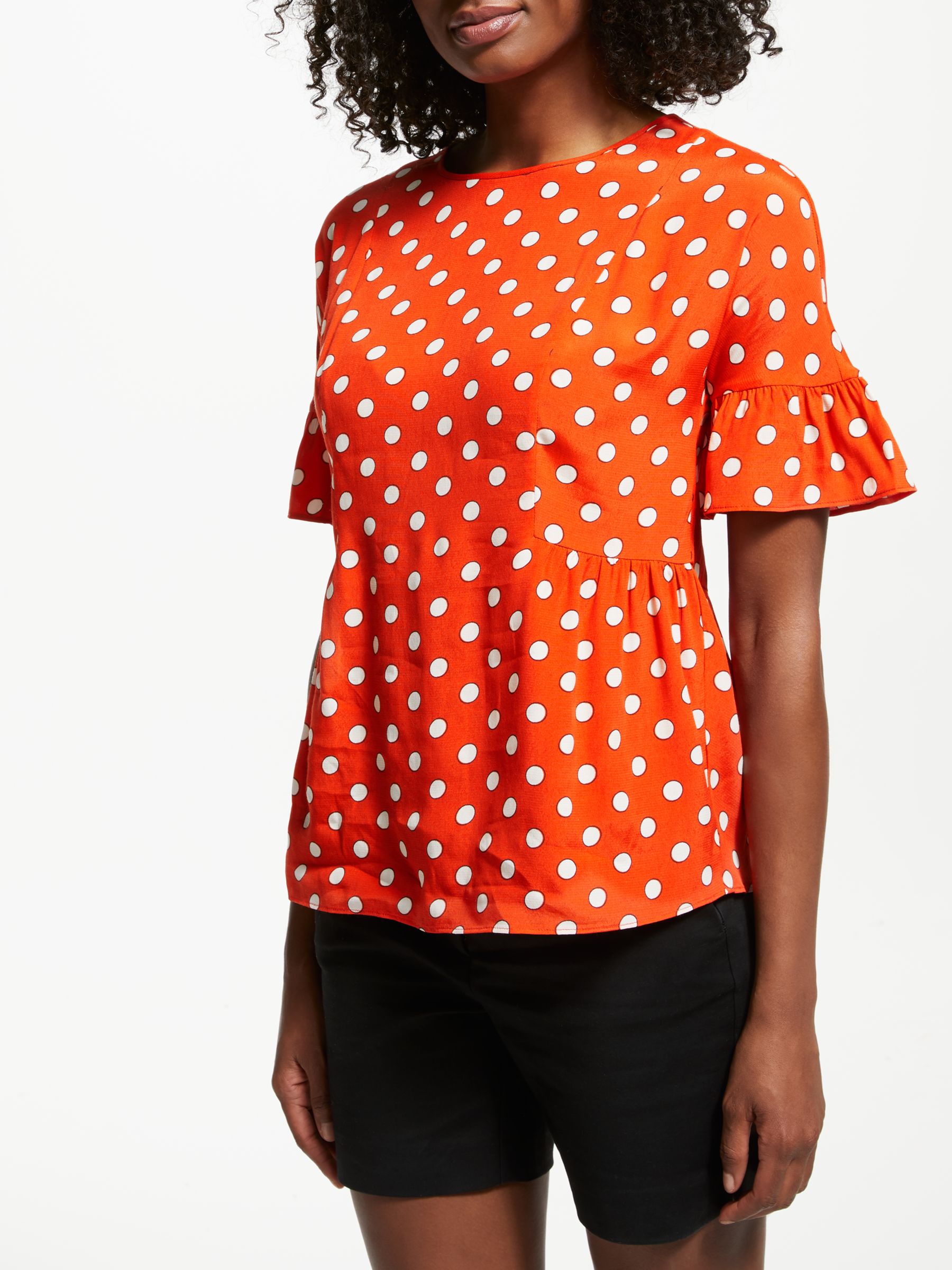 orange polka dot top