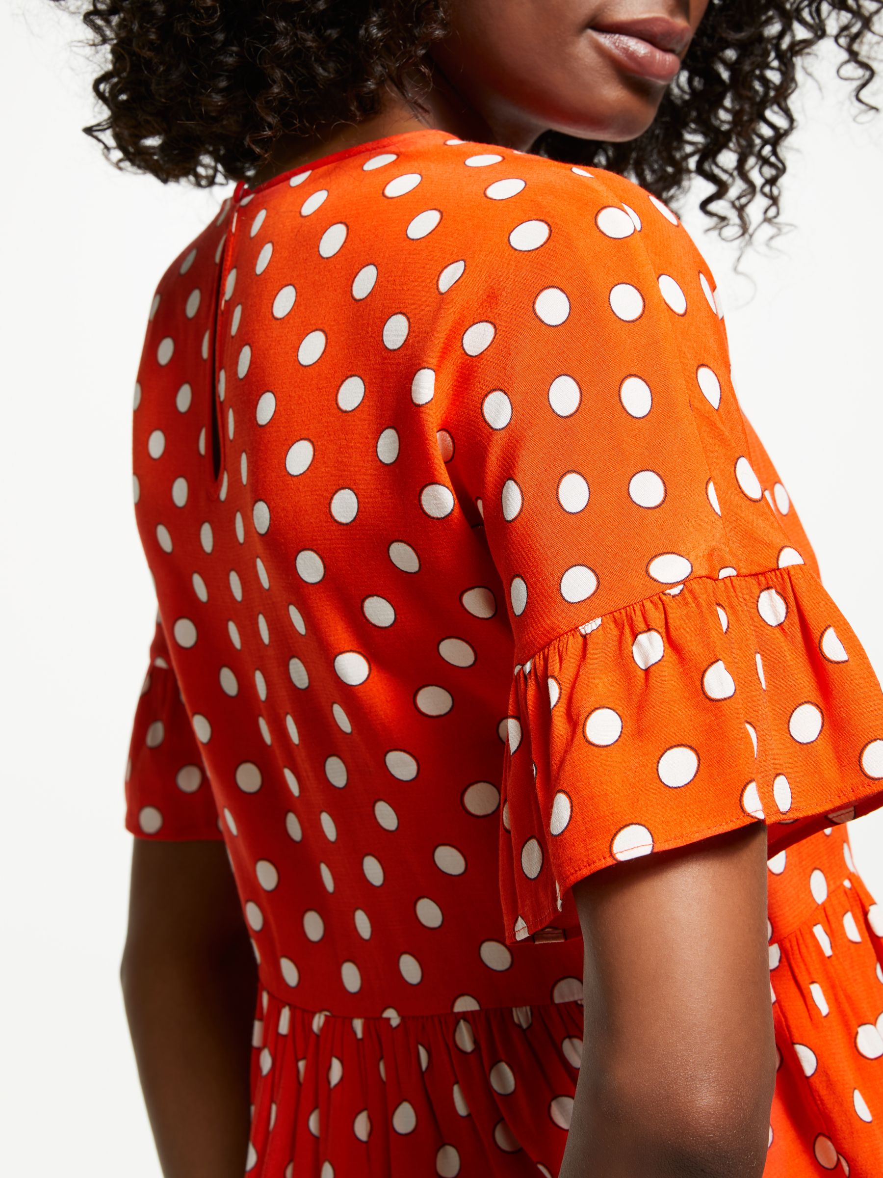 orange polka dot top