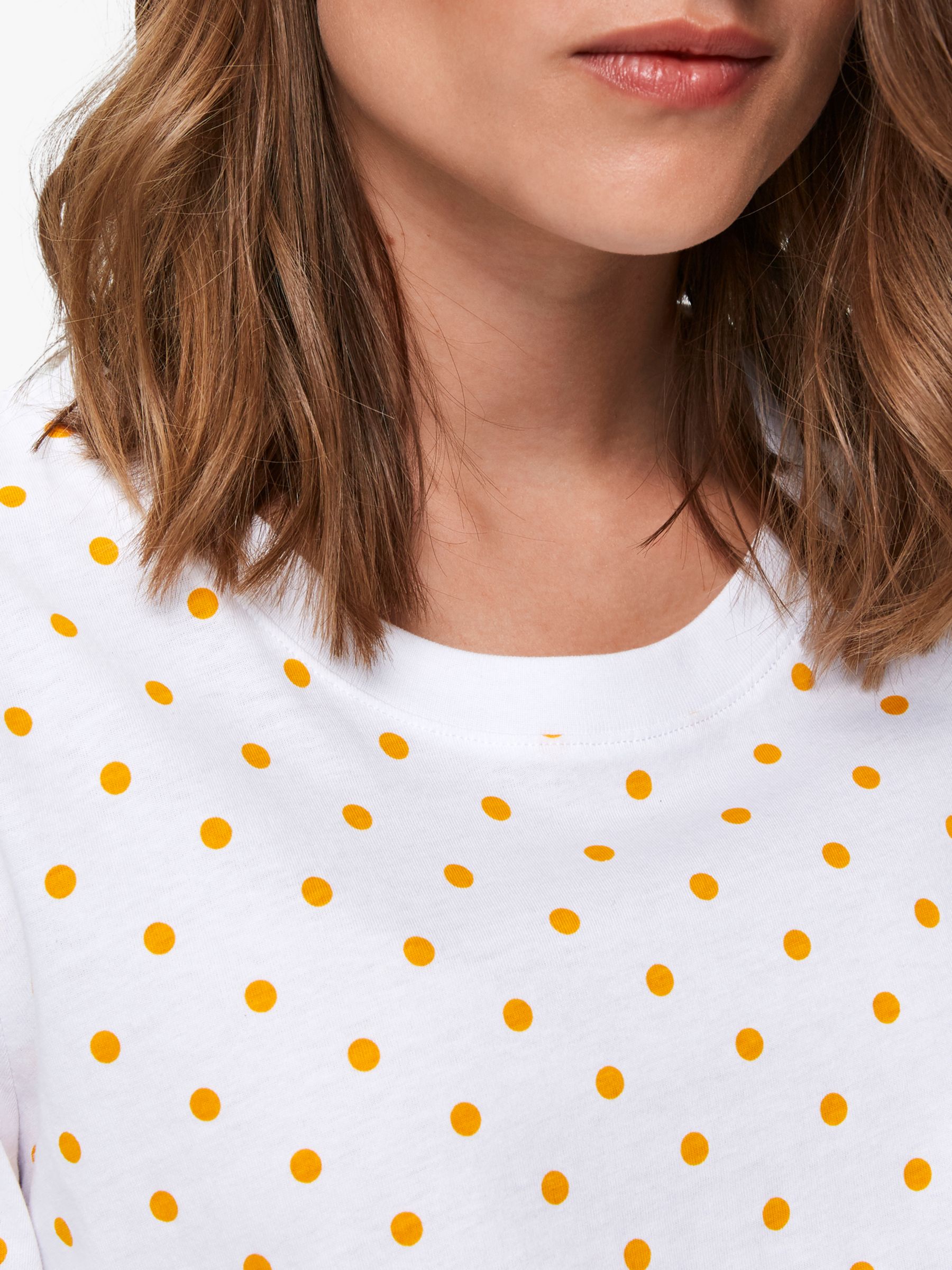 yellow and white polka dot shirt