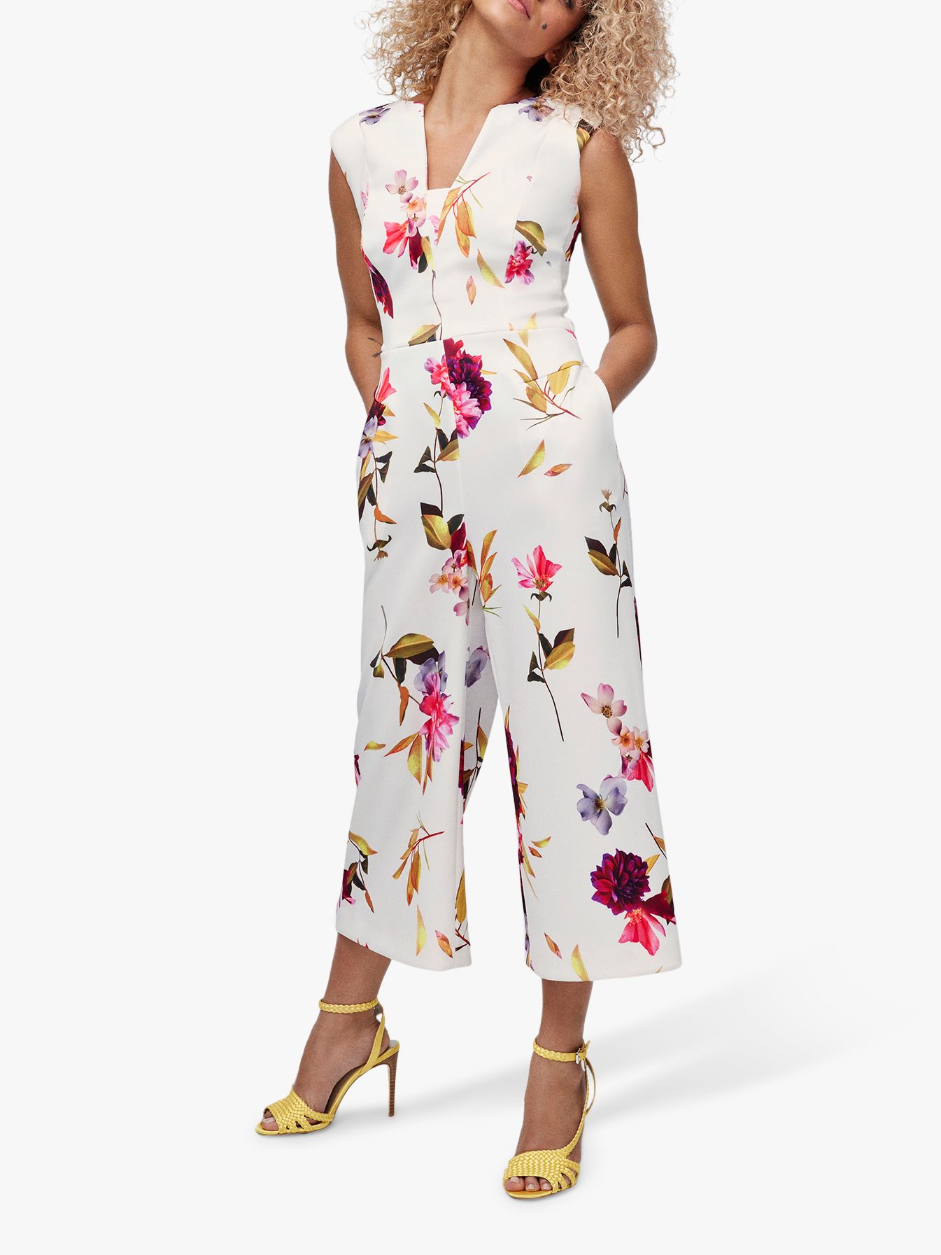 white jumpsuit with flowers