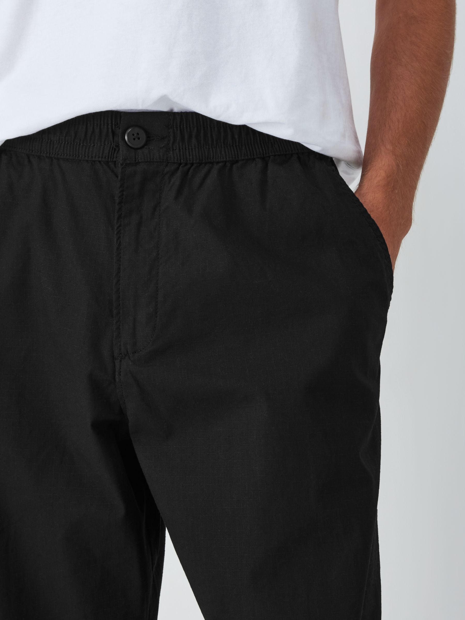 Nike Yoga loose fit trousers with tie detail in black