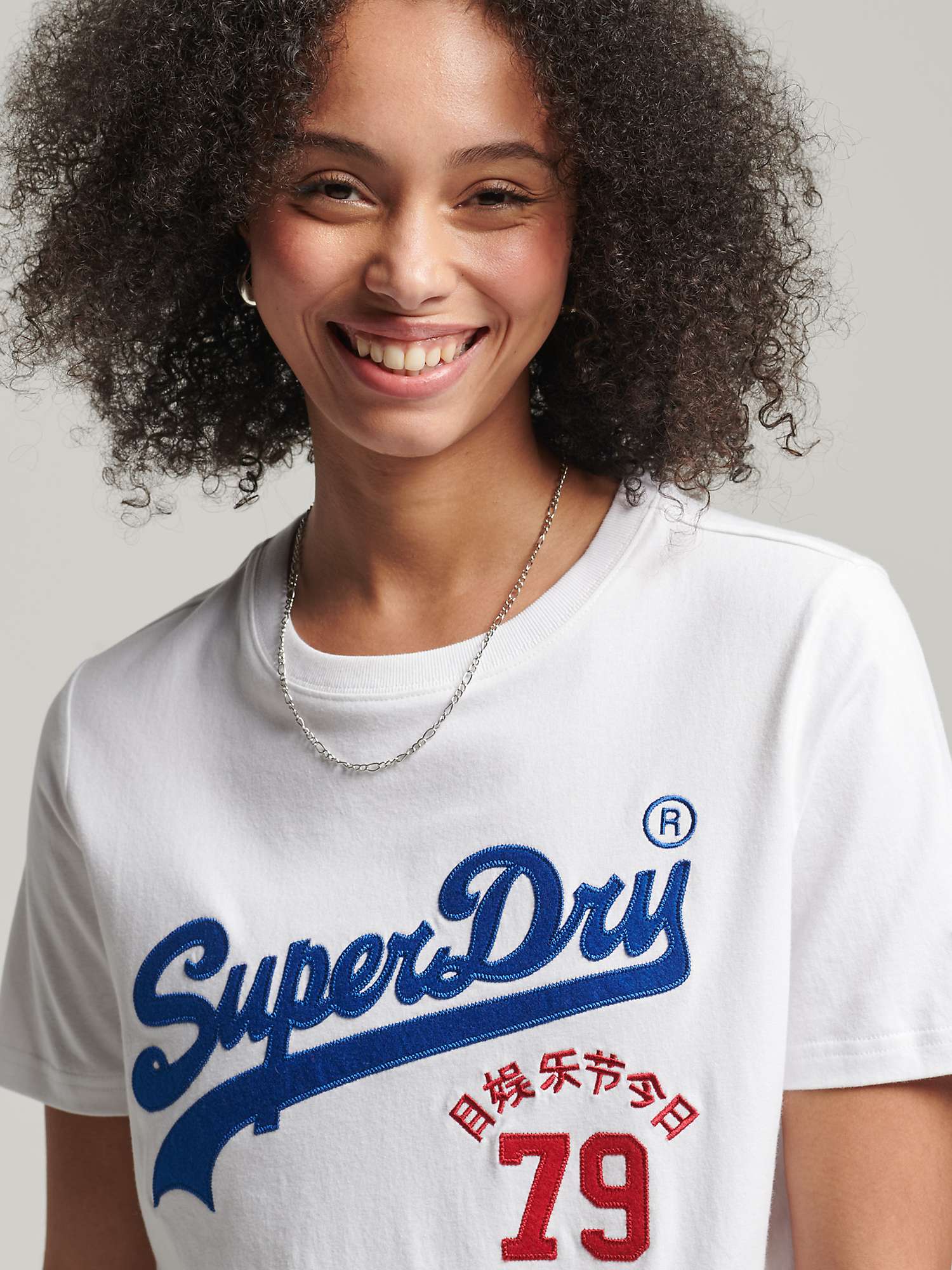 Superdry T-shirt utilisé taille l turquoise avec inscription en lettres blanches 