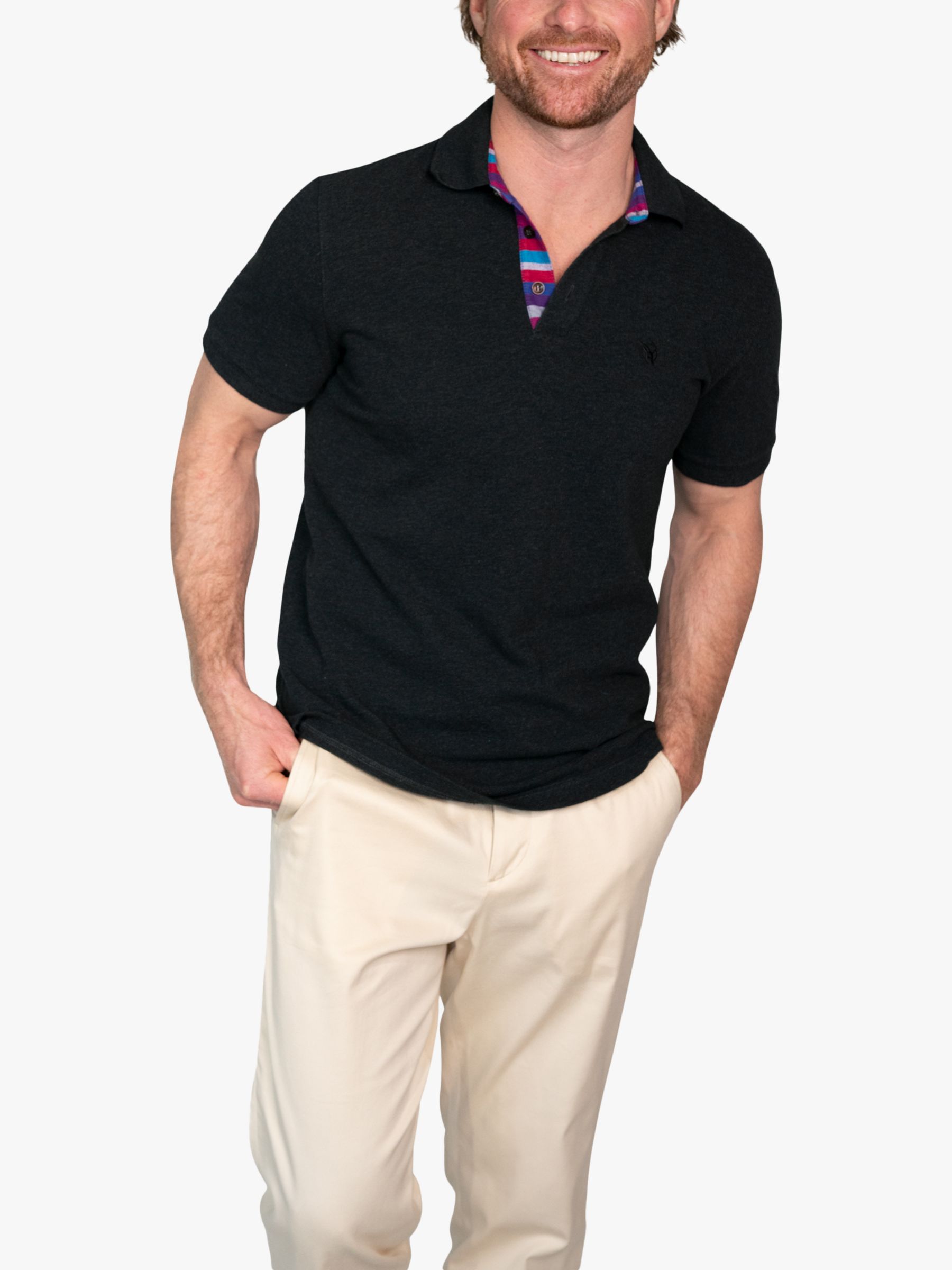 Man Wearing Black Polo Shirt and Gray Dress Pants · Free Stock Photo