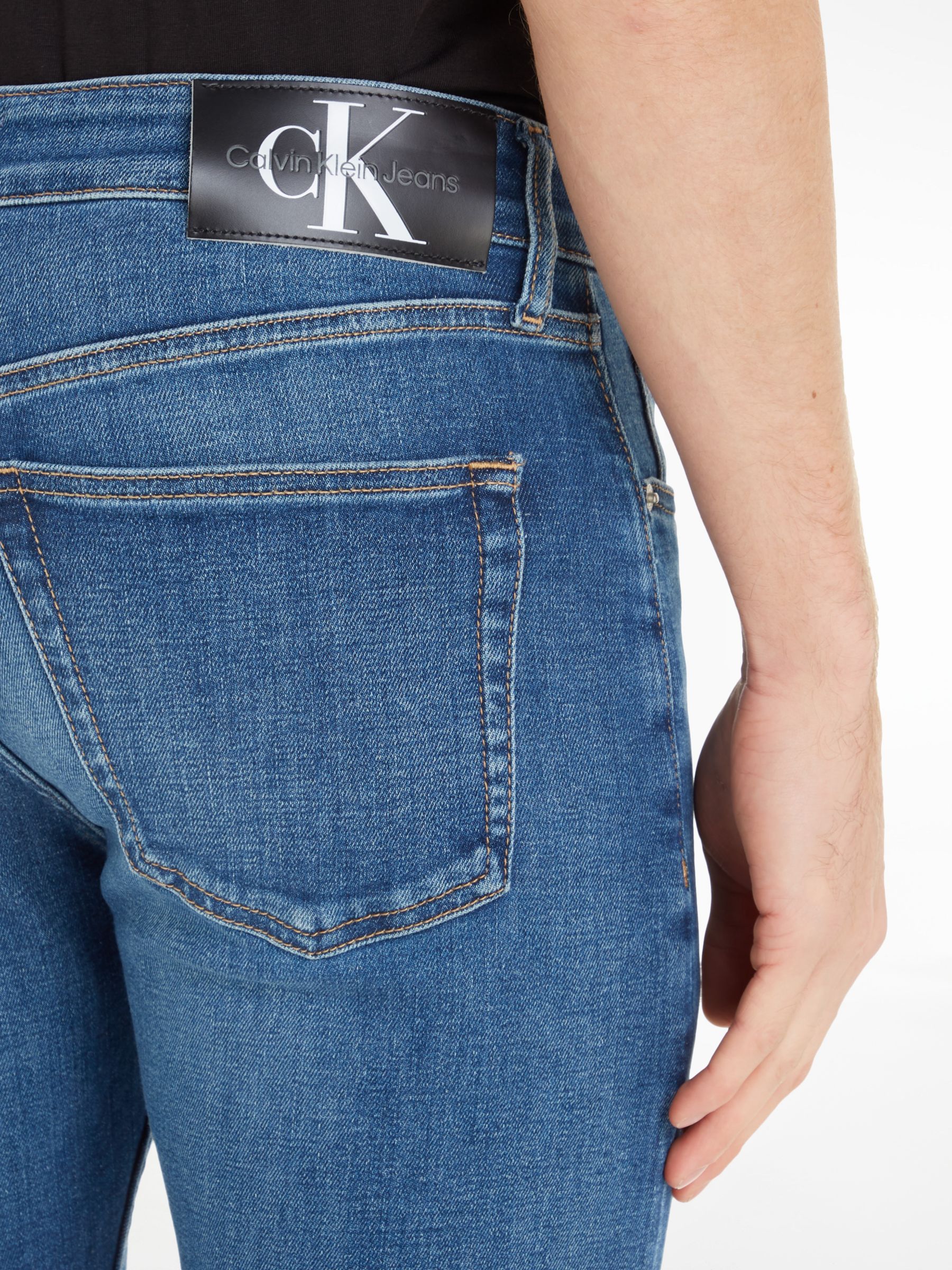 Calvin Klein Slim Tapered Jeans, Denim Dark at John Lewis & Partners