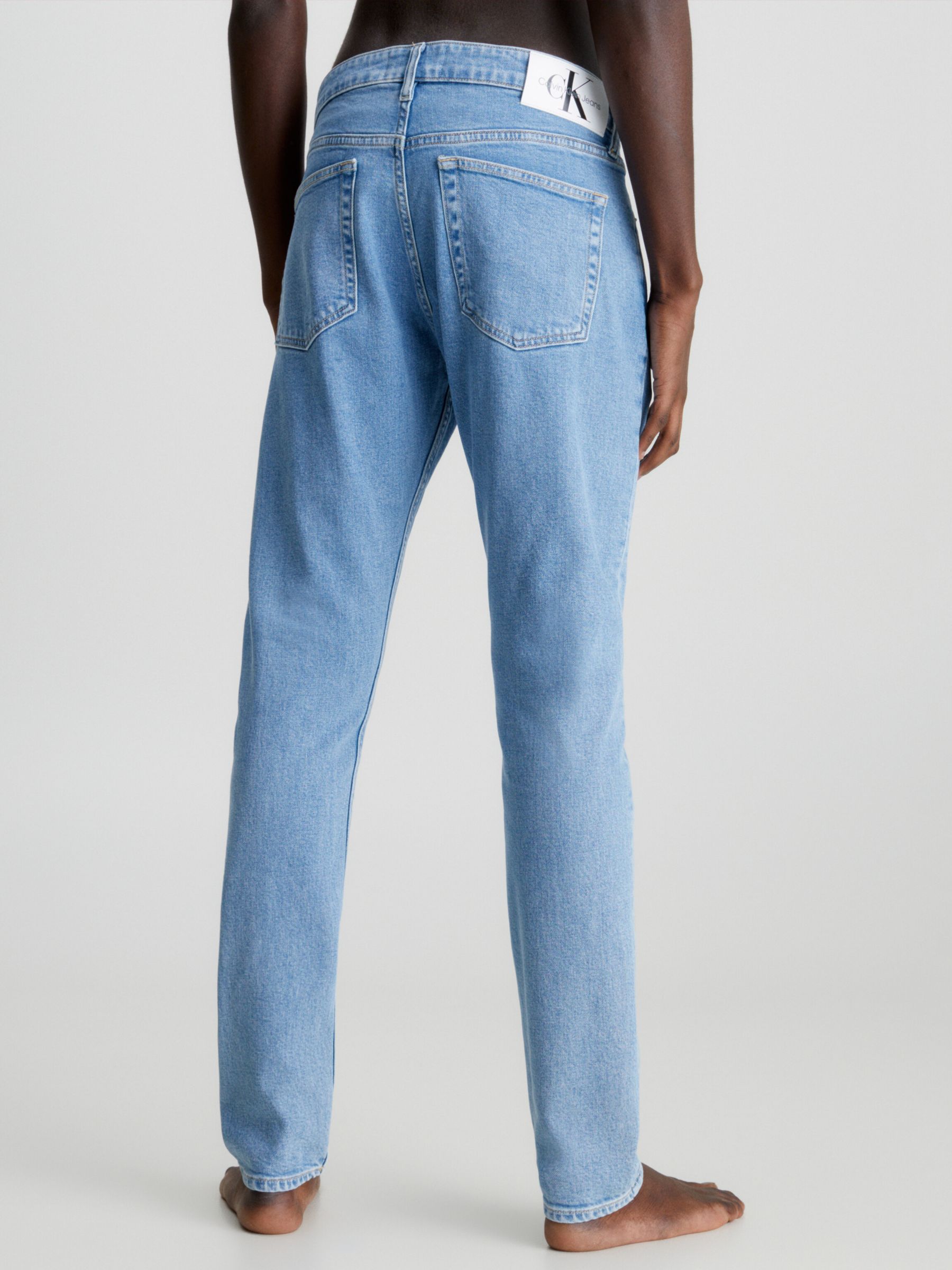 Buy Calvin Klein Slim Tapered Jeans Online at johnlewis.com