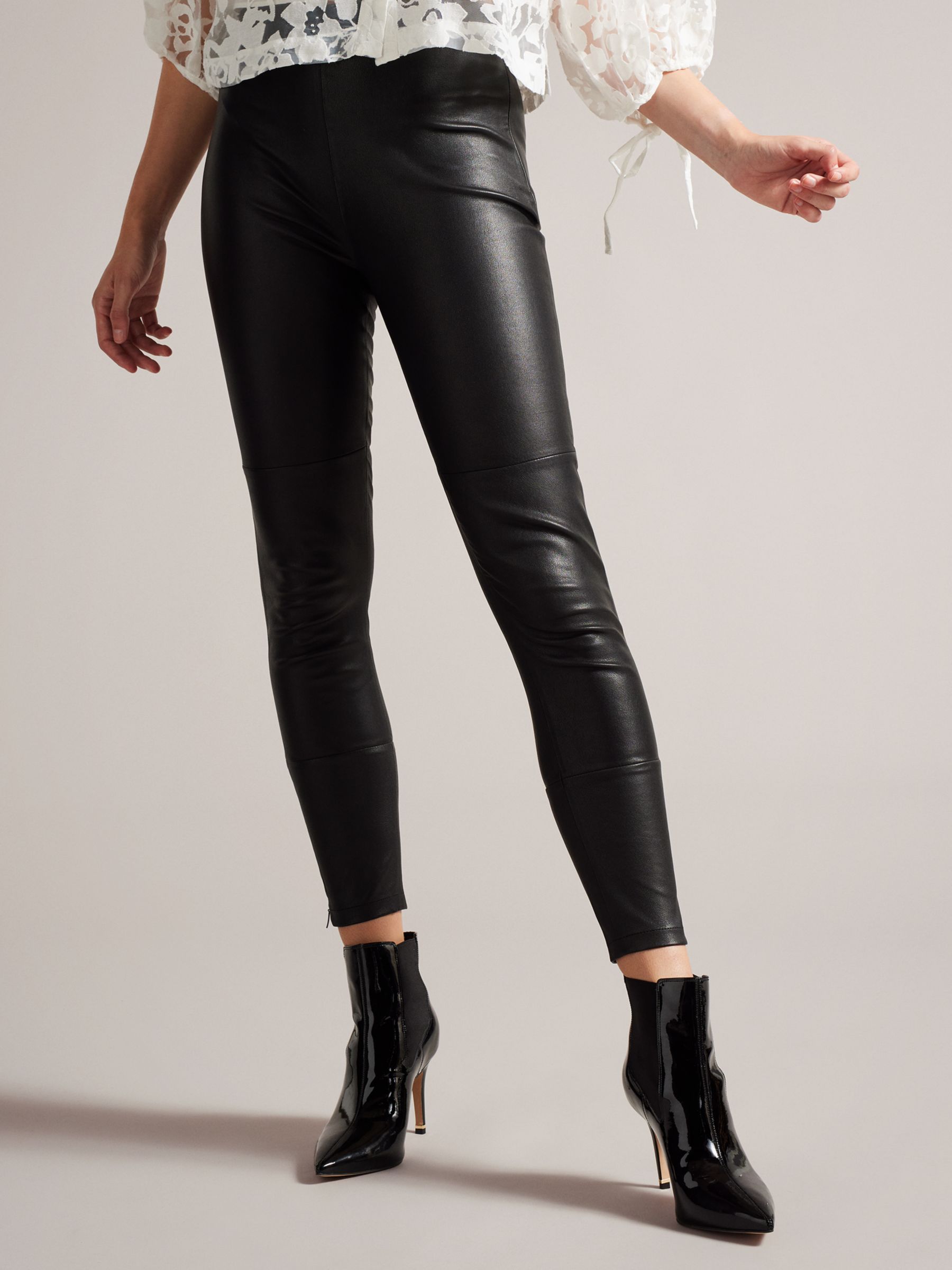 A perfect pair of faux leather high-waisted leggings that you'll be living  in all fall long. Pair them with an oversized sweater or blazer. All black,  of course…