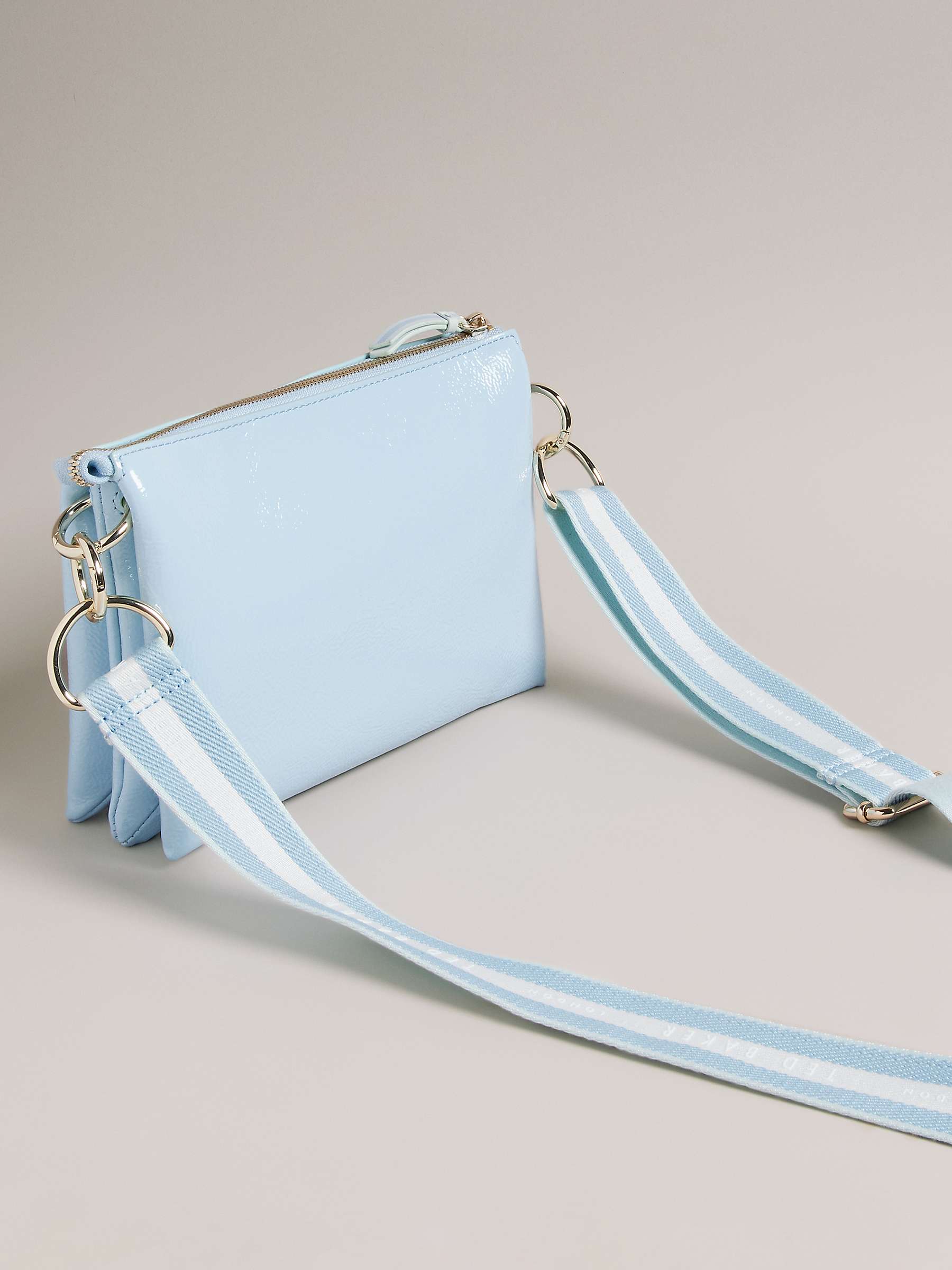 Buy Ted Baker Darceyy Branded Strap Patent Leather Crossbody Bag, Light Blue Online at johnlewis.com