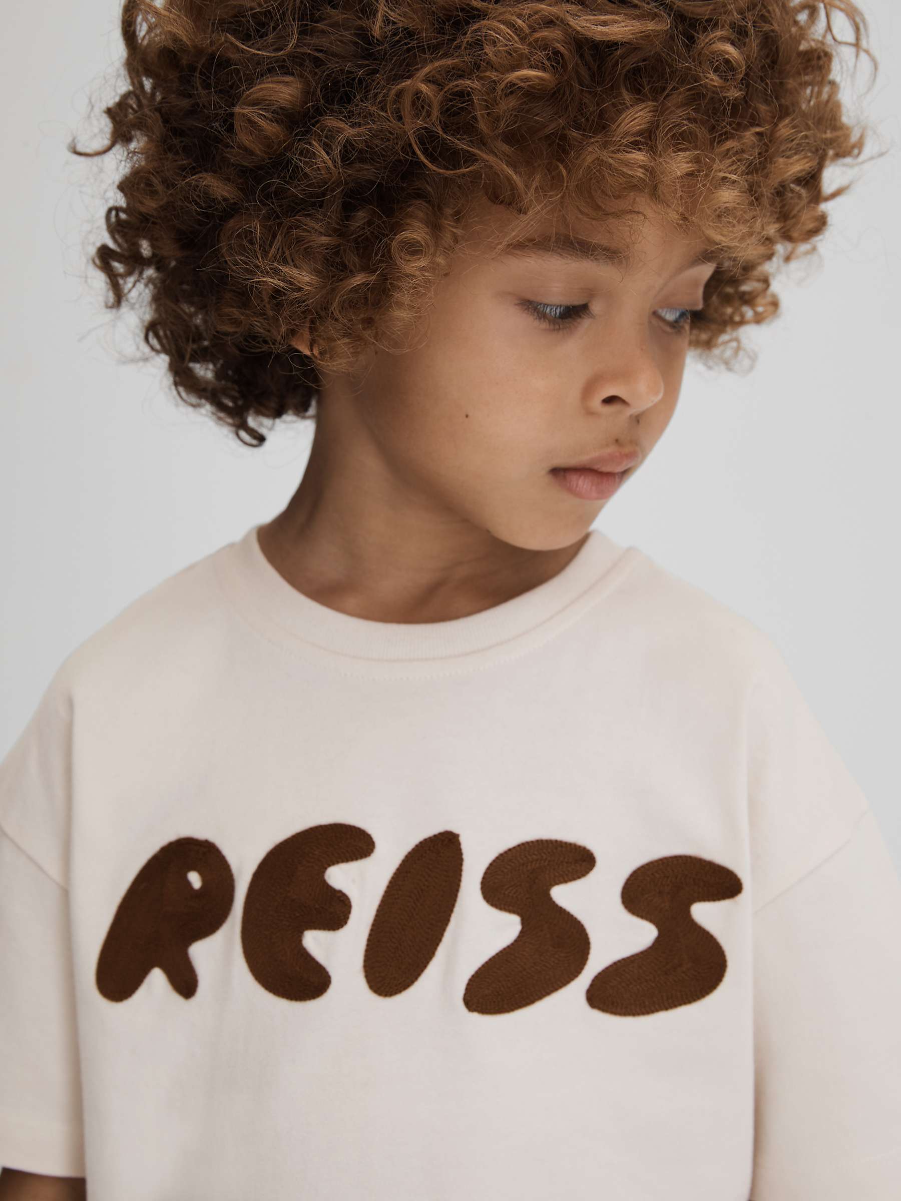 Buy Reiss Kids' Sands Logo Motif Crew Neck T-Shirt, Ecru Online at johnlewis.com