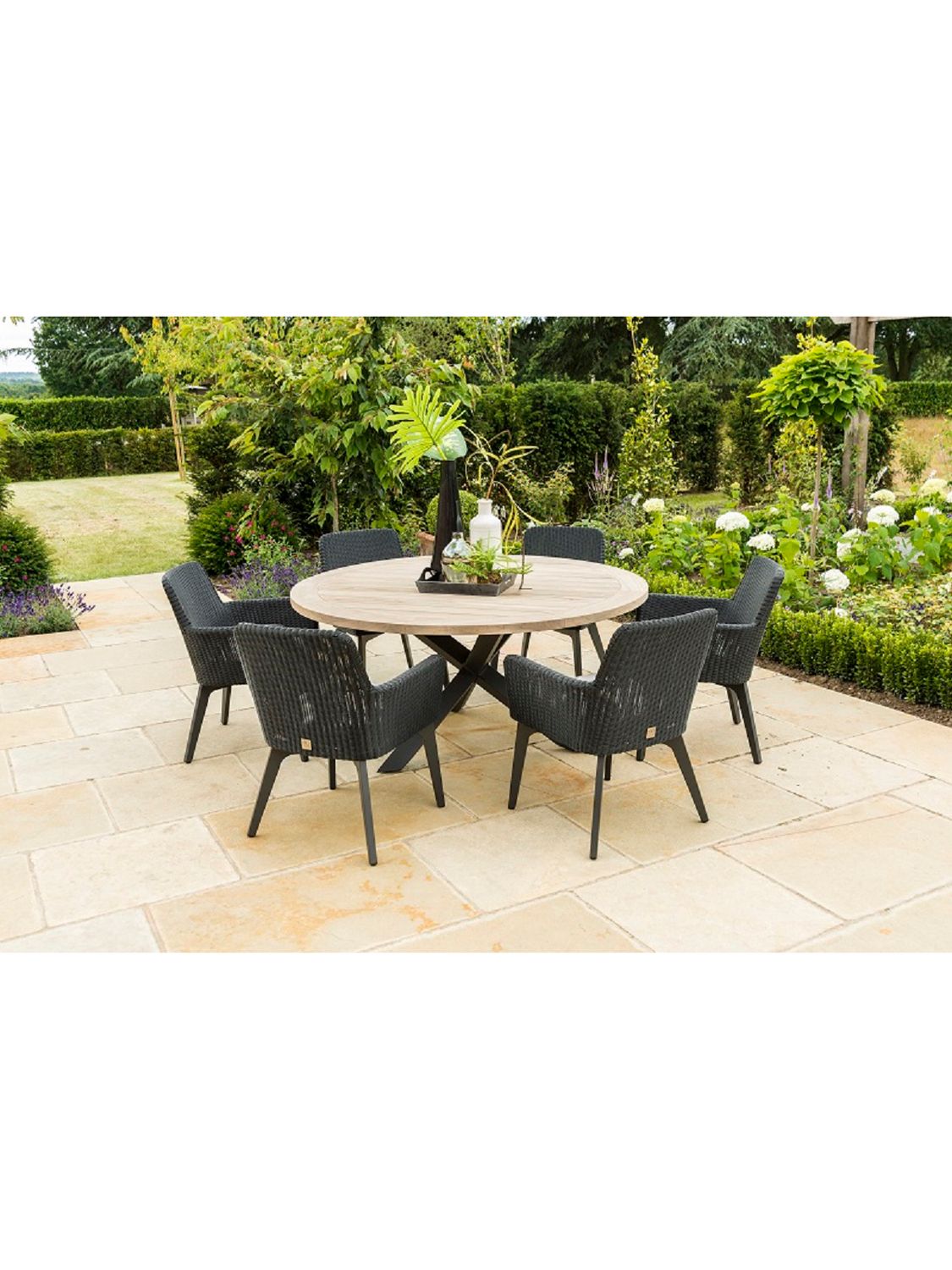 Photo of 4 seasons outdoor lisboa 6-seater round garden dining table & chairs set polyloom anthracite