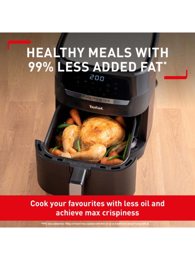 a black deep fryer or oil free fryer , air fryer appliance is on white  marble table