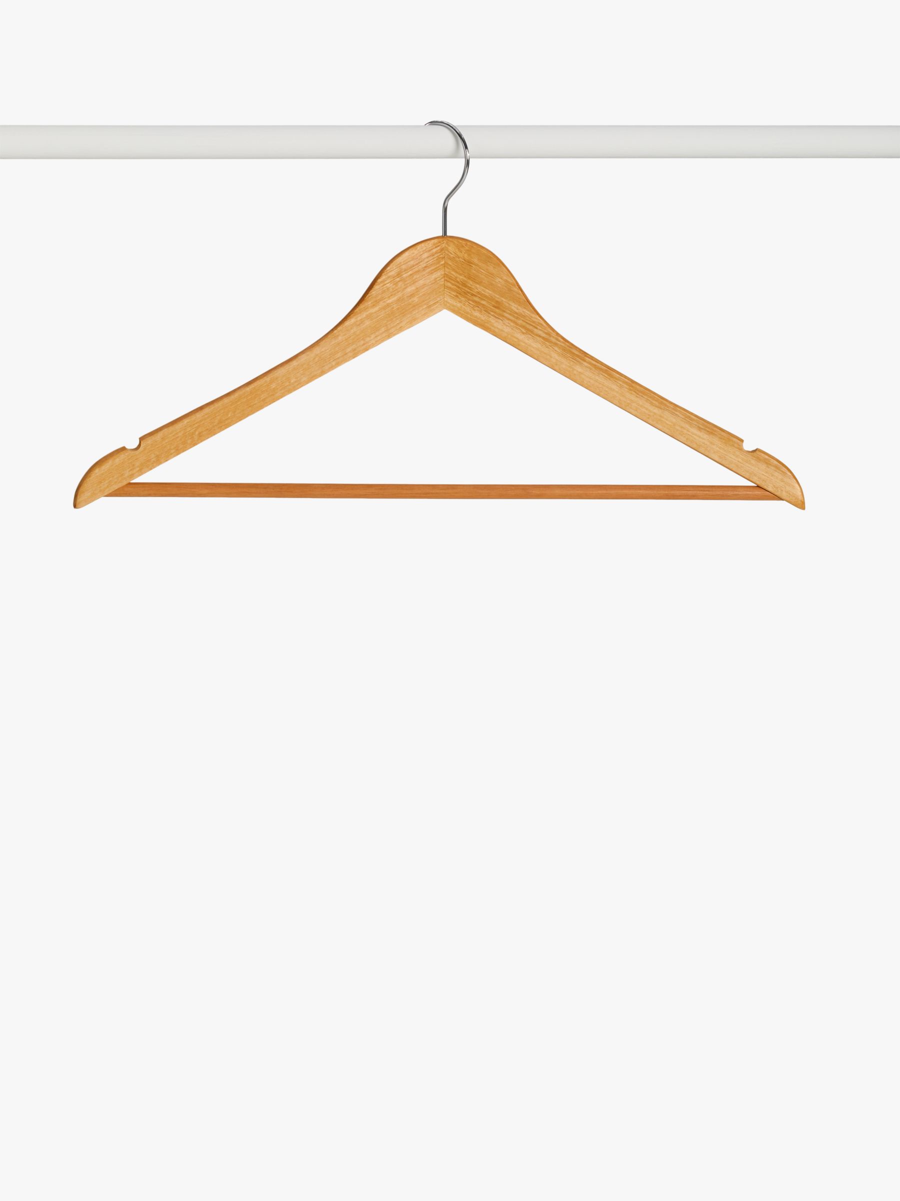 Variety of Sports Bra on Brown Wooden Clothes Hangers · Free Stock