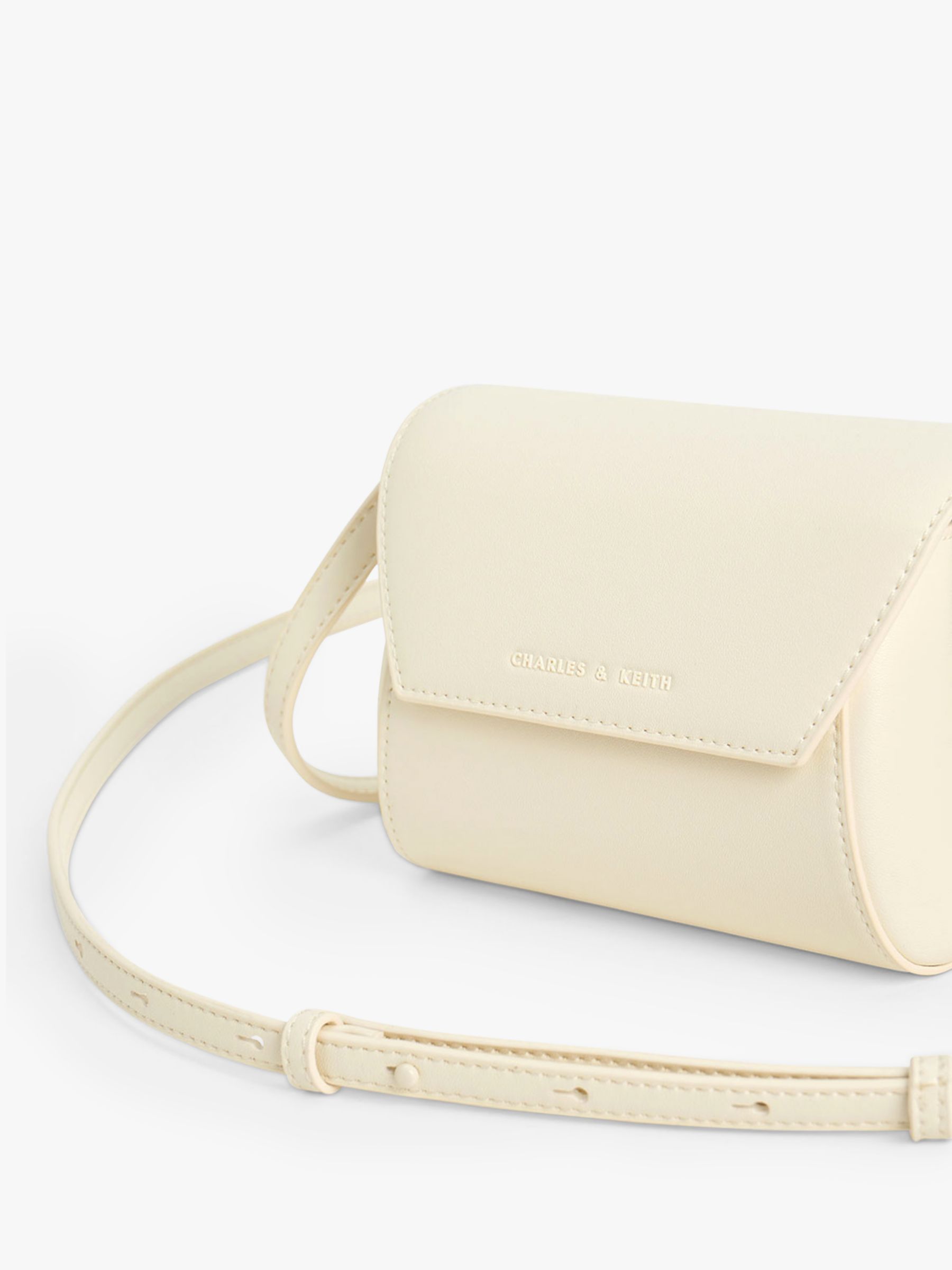 CHARLES & KEITH Cassiopeia Mini Cross Body Bag, Cream at John Lewis ...