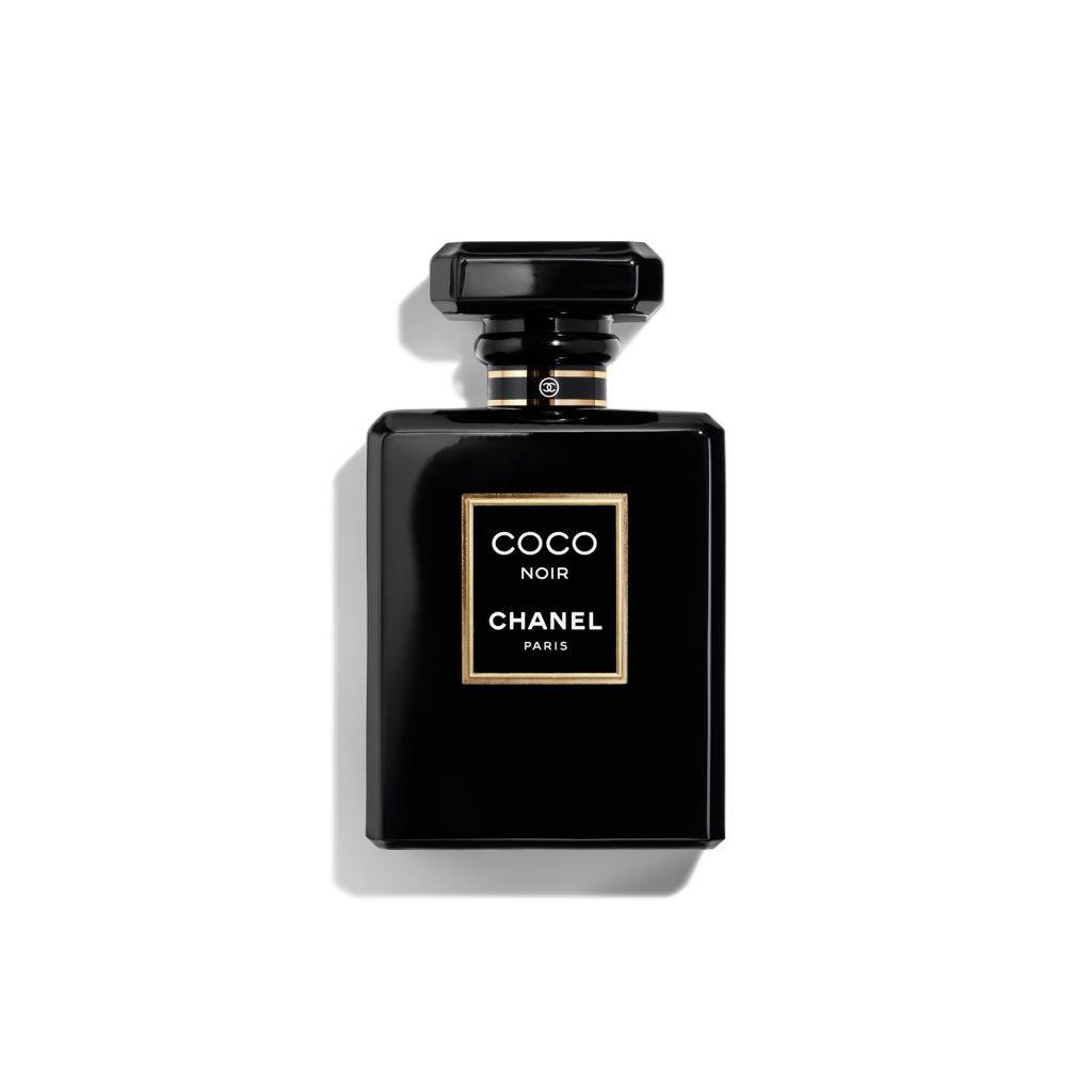 TERNOPIL, UKRAINE - SEPTEMBER 2, 2022 Coco Noir Chanel Paris worldwide  famous french perfume black bottle on shiny glitter background in purple  colors 13586996 Stock Photo at Vecteezy