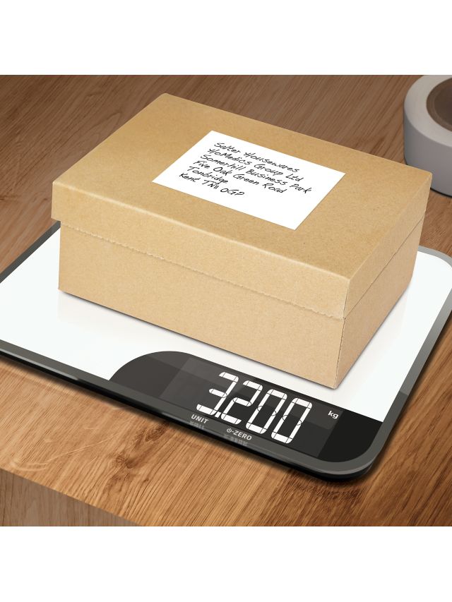 white salter kitchen weighing scale on chopping board Stock Photo