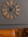 Libra Interiors Skeleton Roman Numeral Round Outdoor Wall Clock, 70cm, Antique Brass
