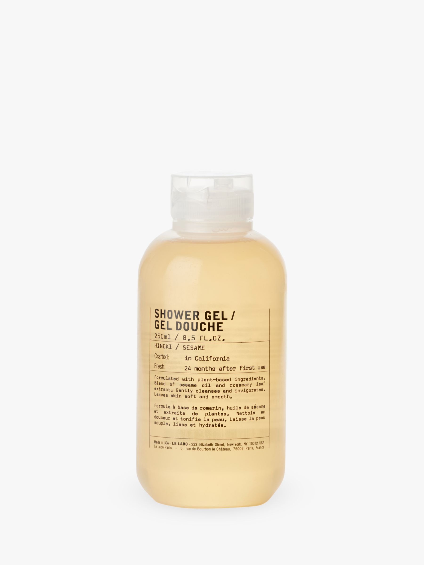 Bottle of Hinoki shower gel on a white background