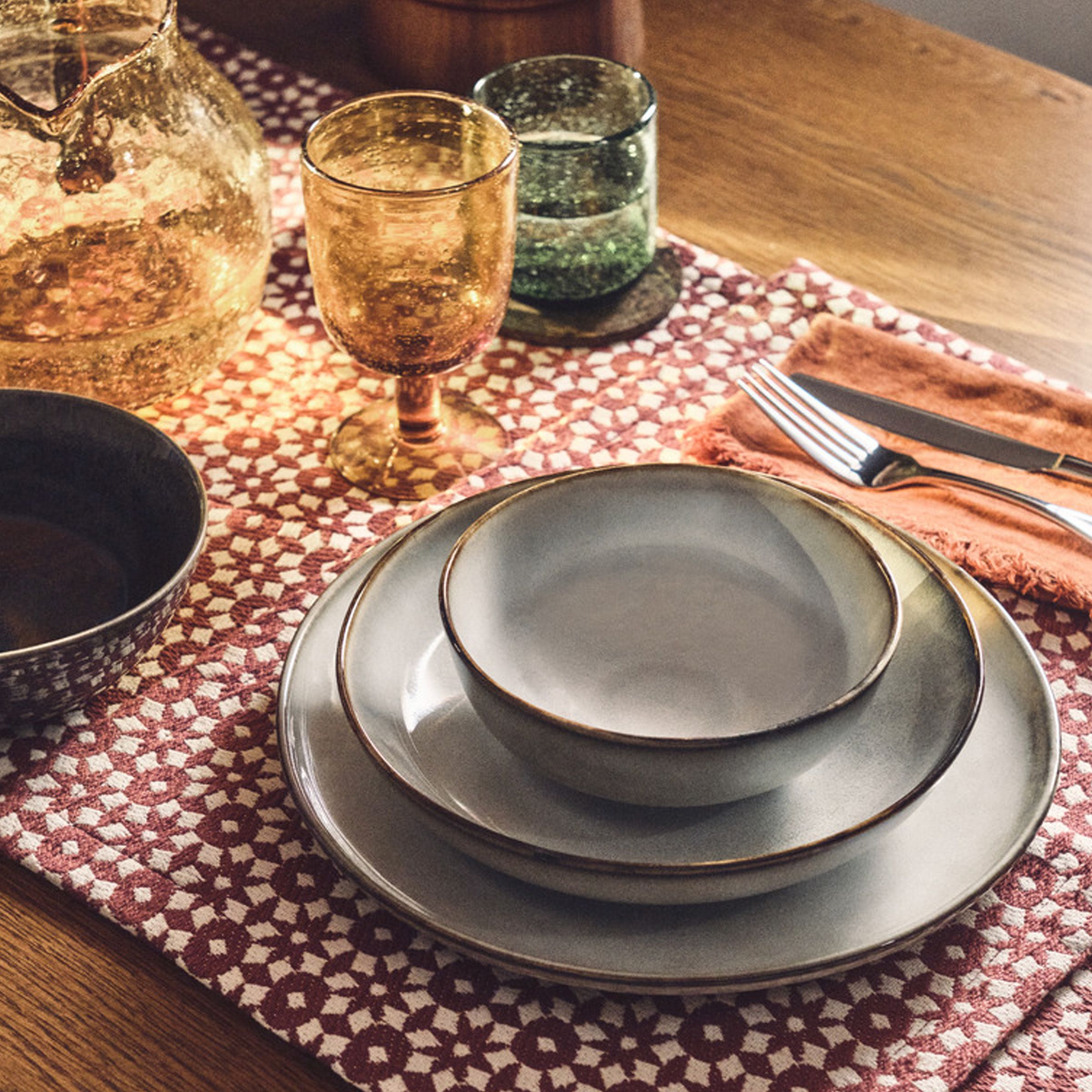 lifestyle image of a rustic style dinner set sitting on a table