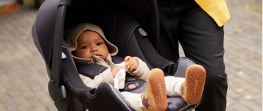 A child in their car seat