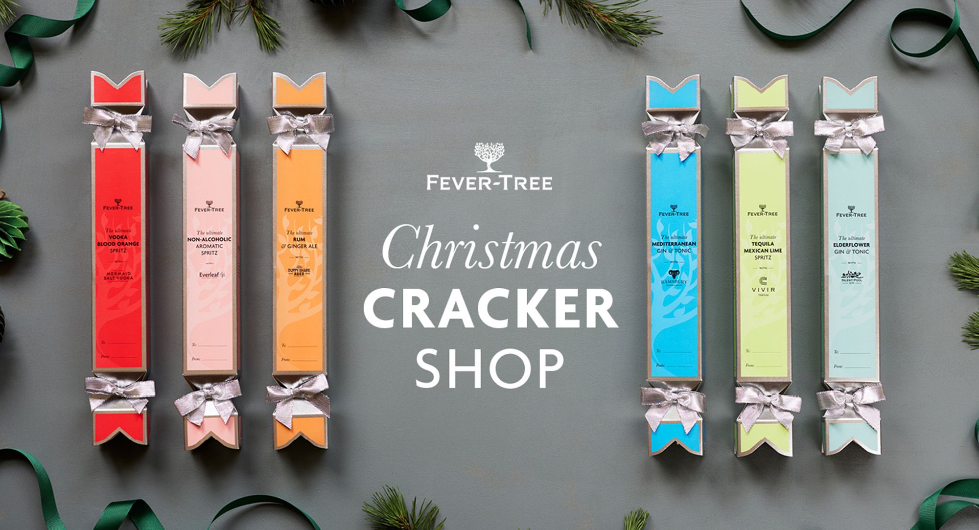 Image of a box of Fever Tree Crackers on a table with a Christmas Tree background