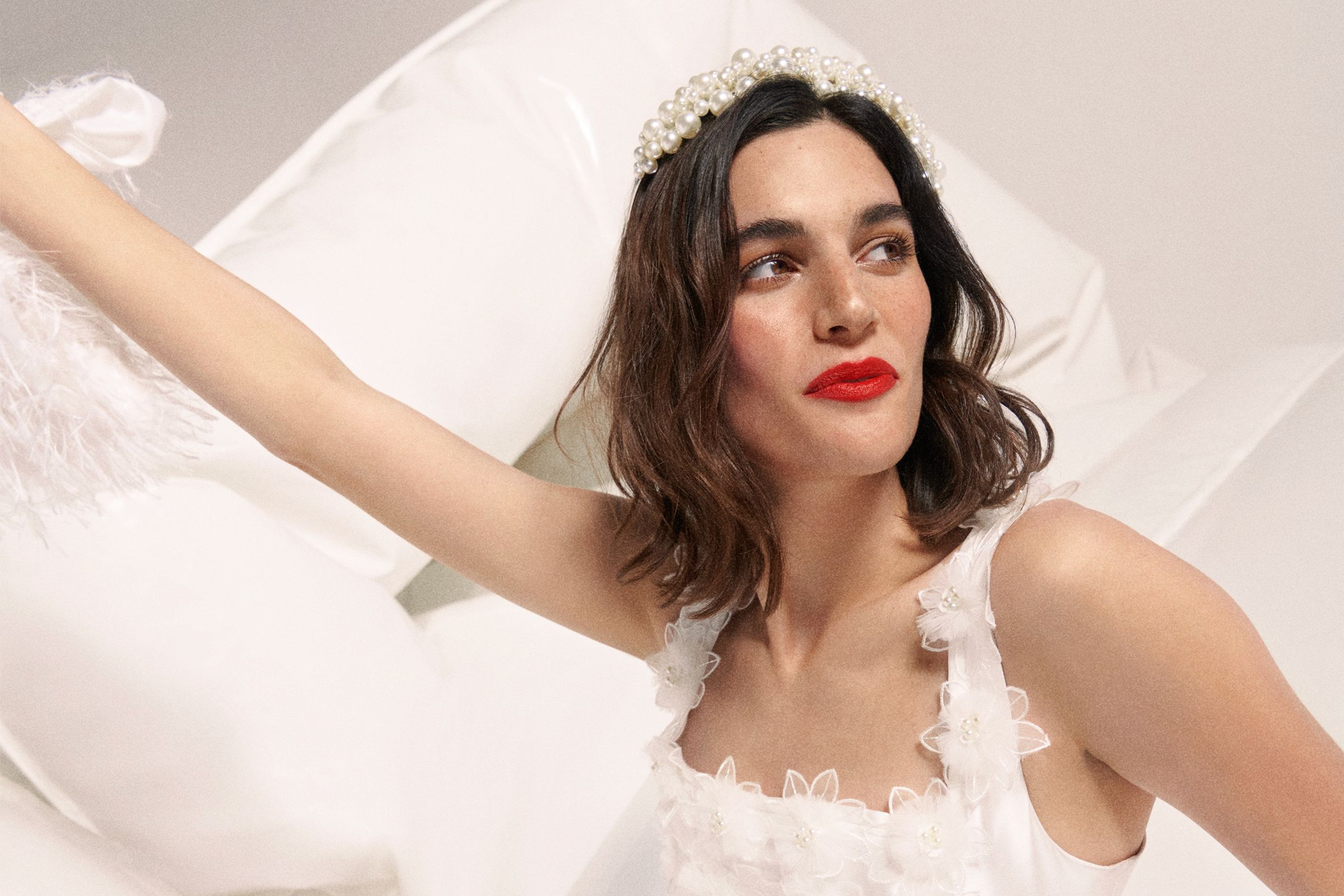 Image of a wedding model with bold brows and red lipstick