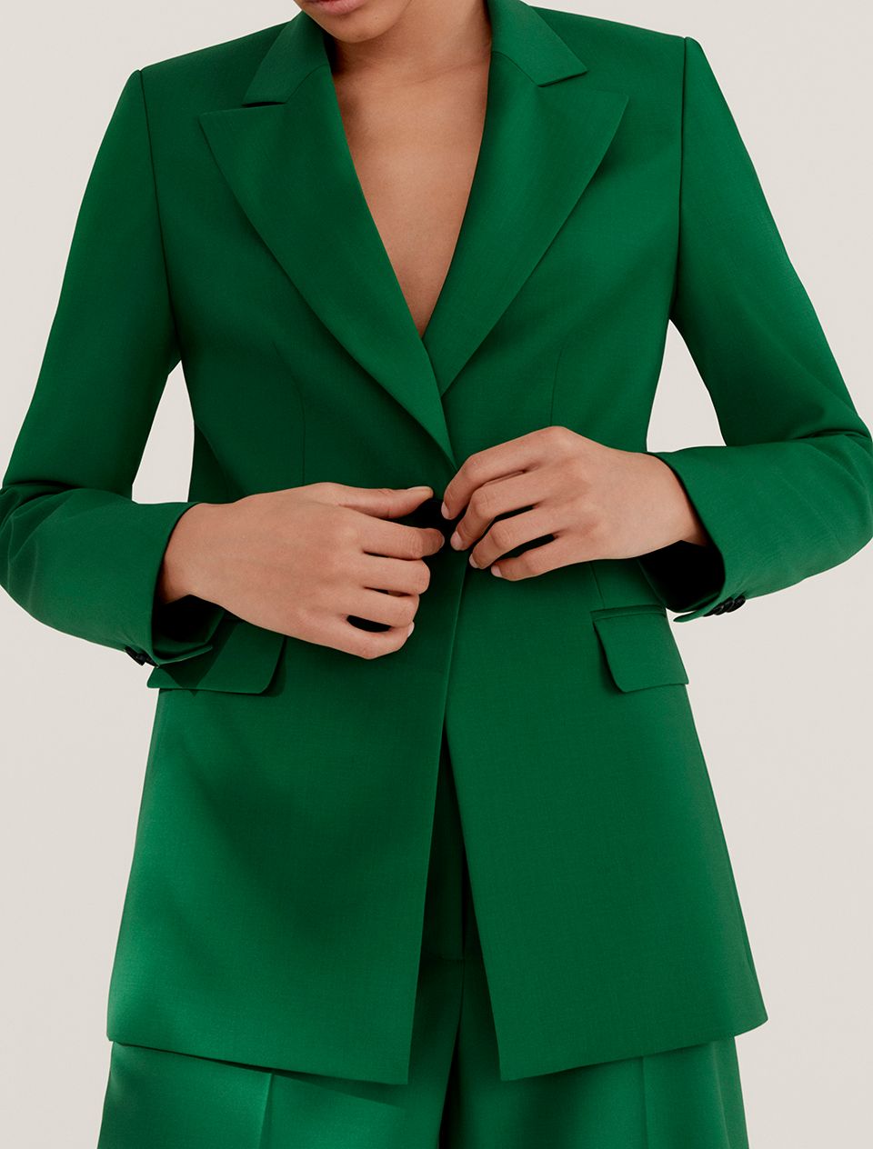 Woman in a green suit
