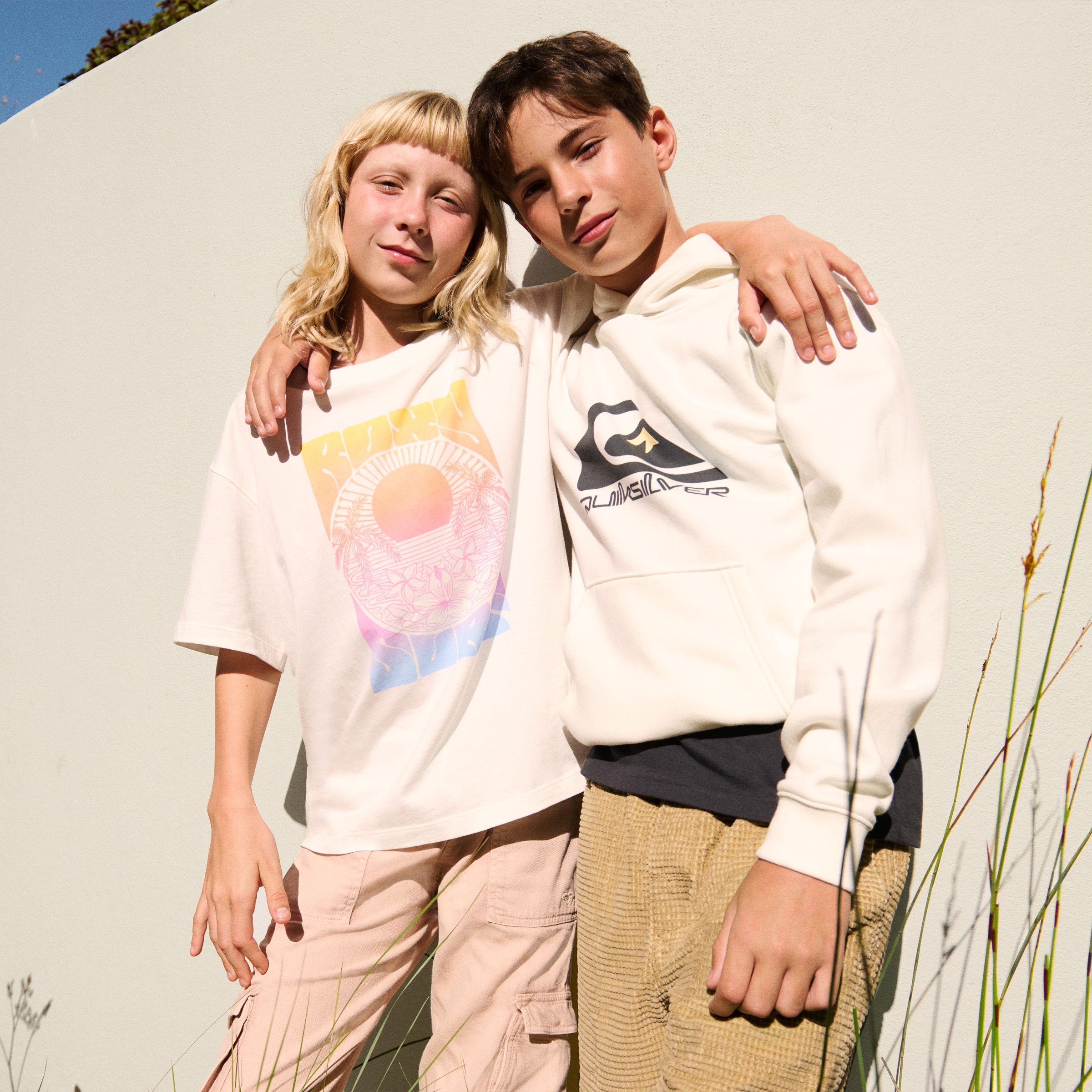 boy and a girl wearing surf / skate style clothing