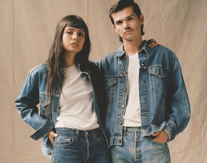 Image of a woman and a man head to toe in Levis