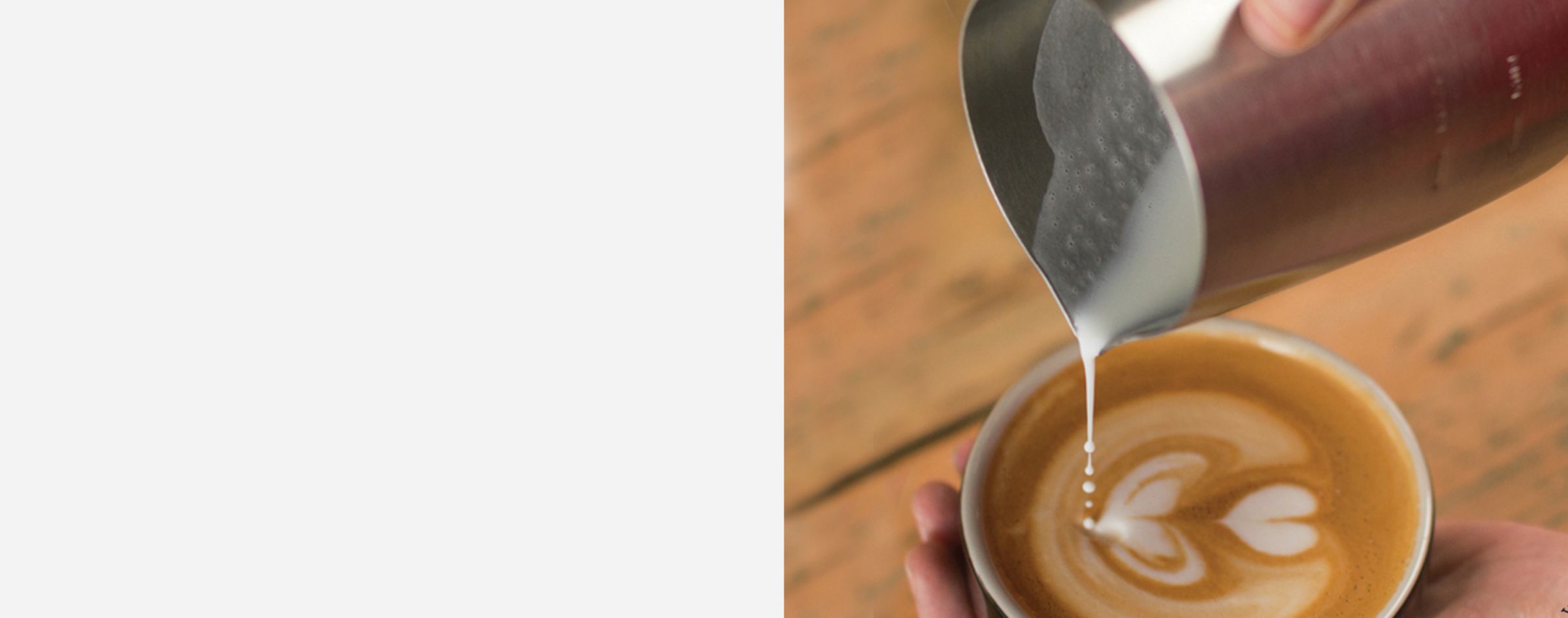 Sage Masterclass barista pouring milk design into coffee