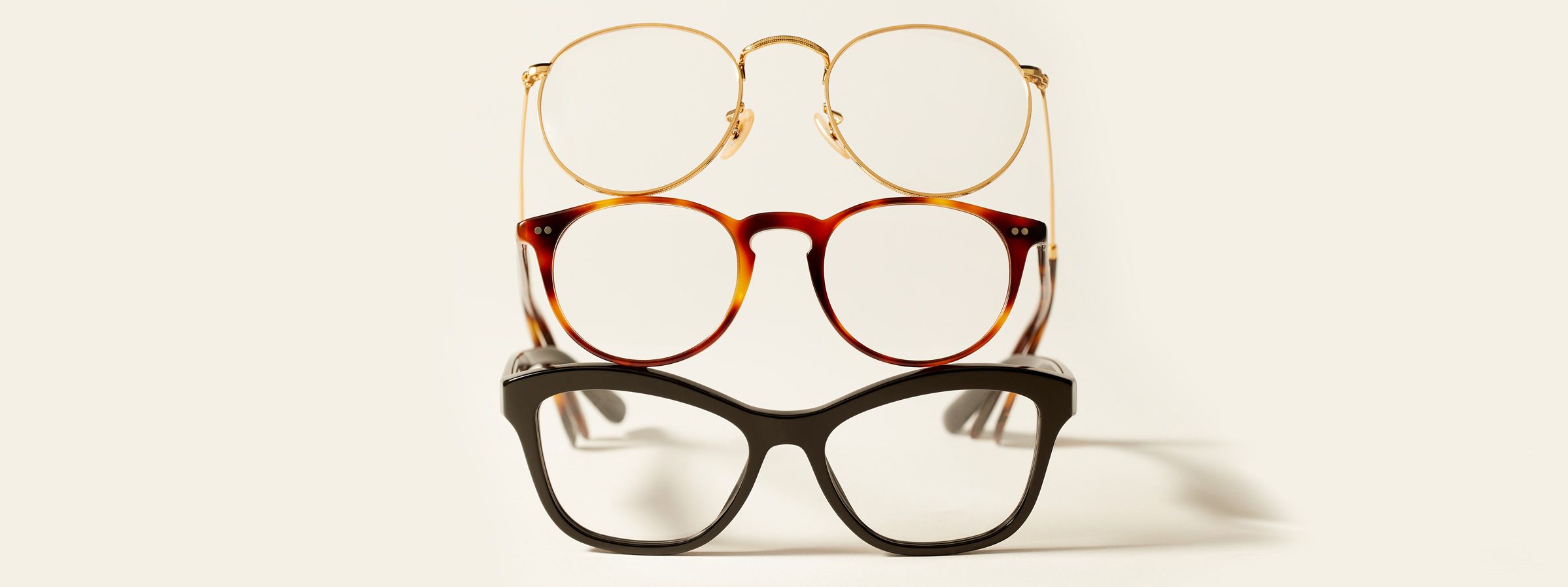 an image of three reading glasses stacked ontop of eachother