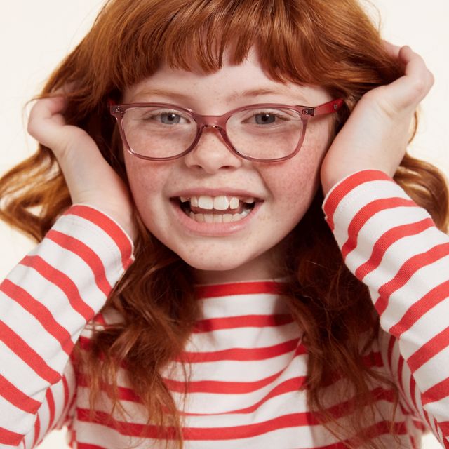 a moving image of a red haired girl wearing glasses