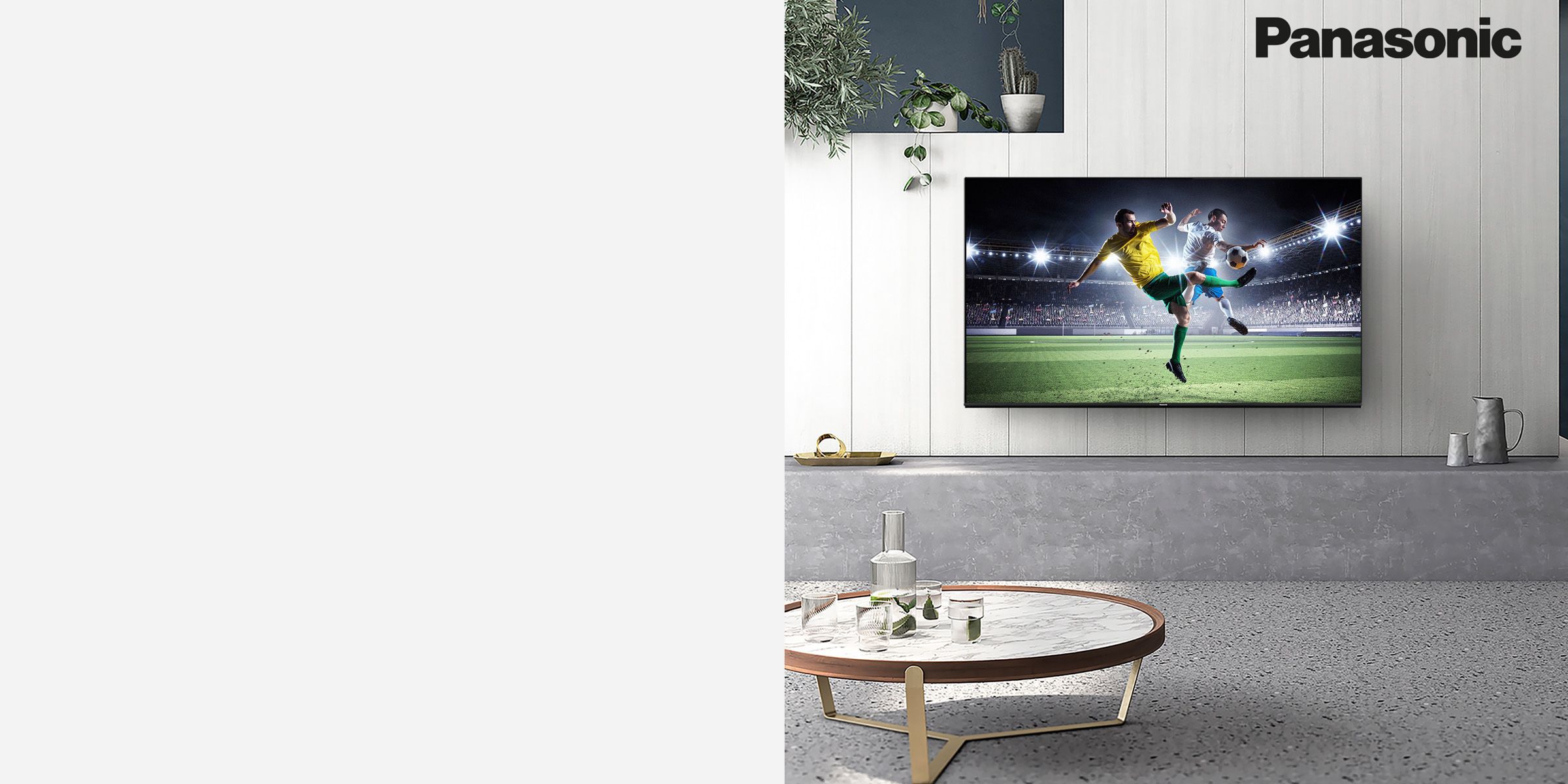 Panasonic TV on a wall showing the football