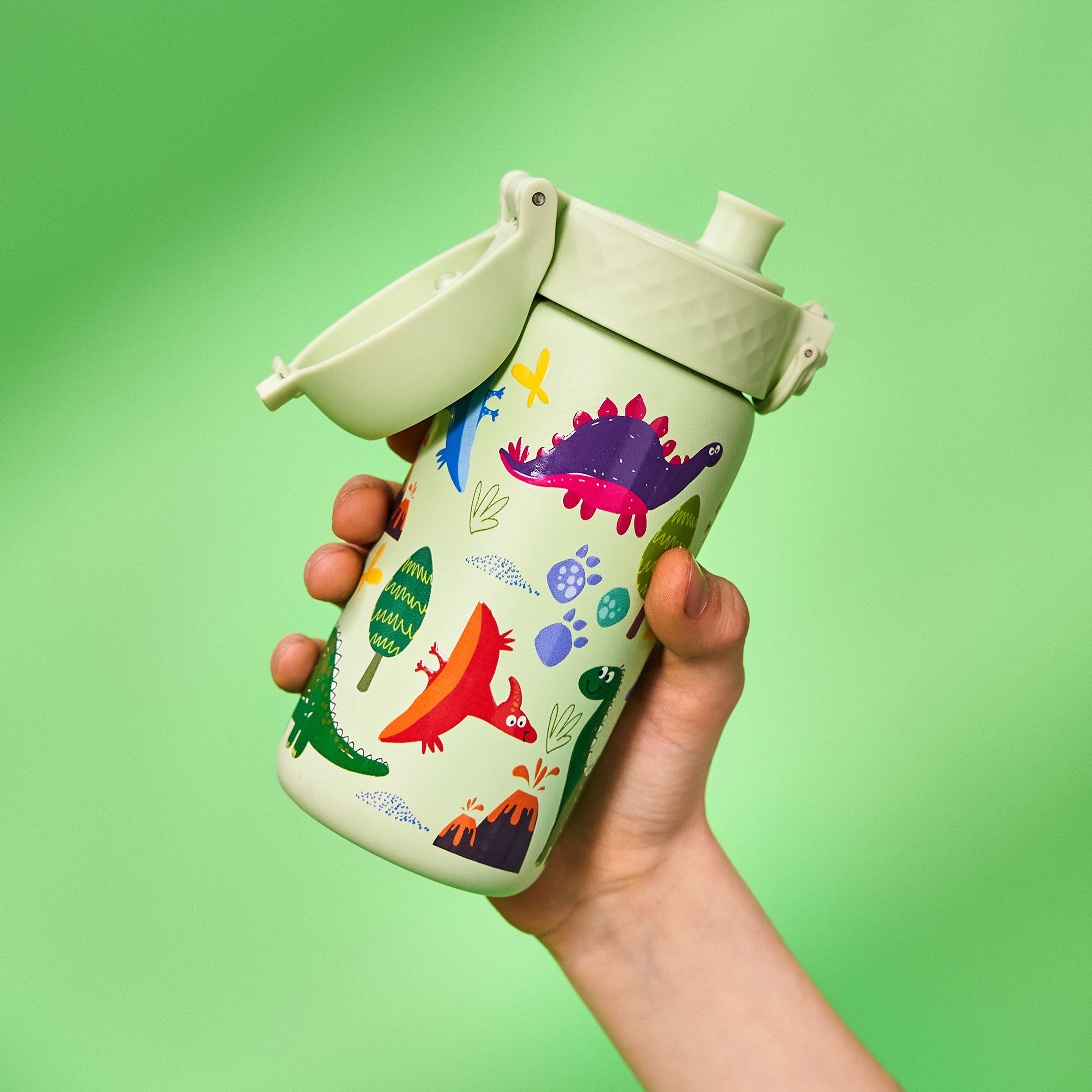 water bottle with cute dinosaurs on it with a green neon background behind. Leak-proof water bottles perfect for back-to-school, with fun designs, hygienic covers & easy opening.