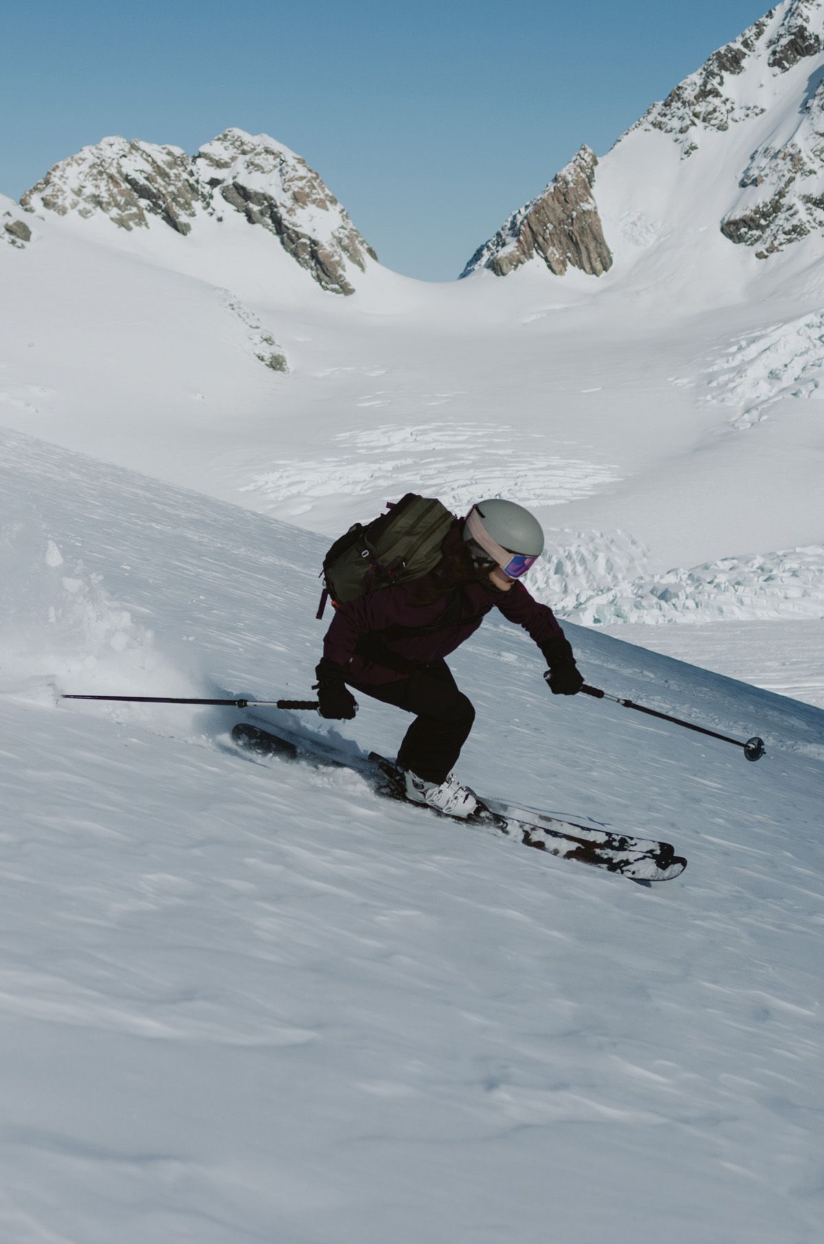 Person skiing down a snowy mountain.