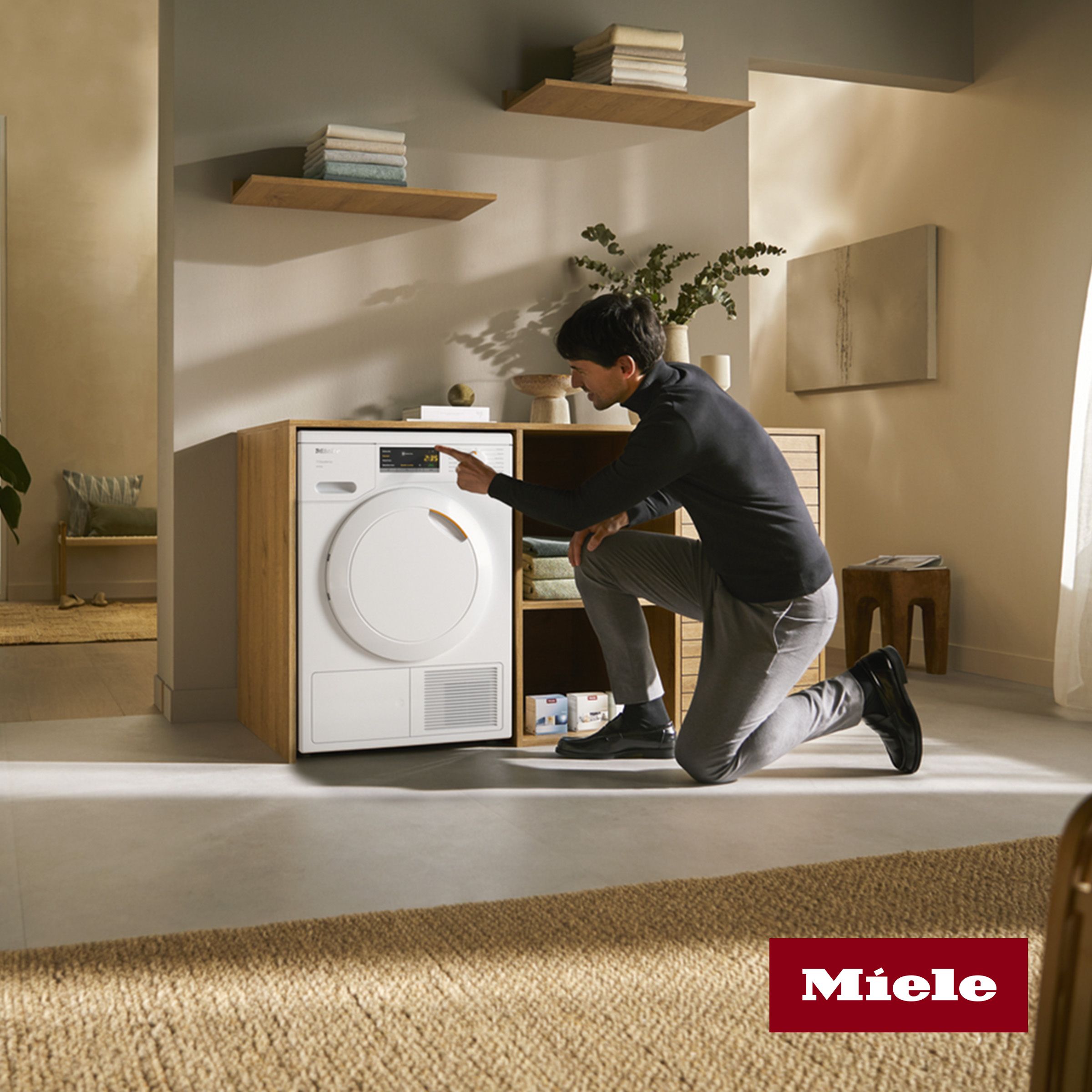 Man using Miele Washing Machines & Tumble Dryer