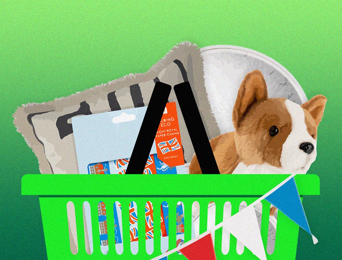 John Lewis & Partners basket filled with bunting, coogie soft toy and pillows