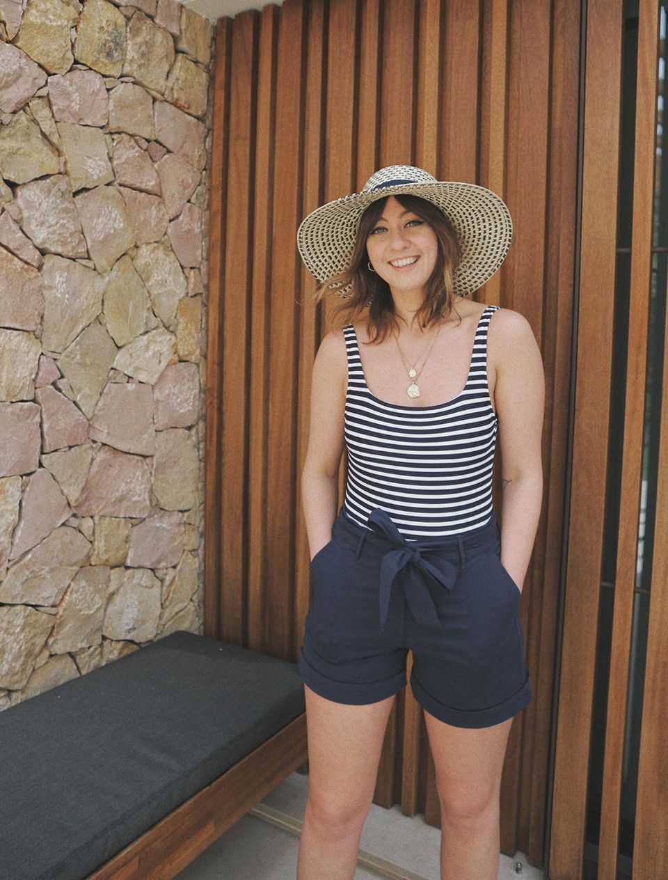 Rachael Clifton styles a stripy swimsuit as a top 